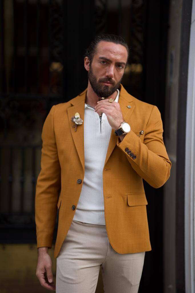 A  camel-colored jacket with a dapper desig
