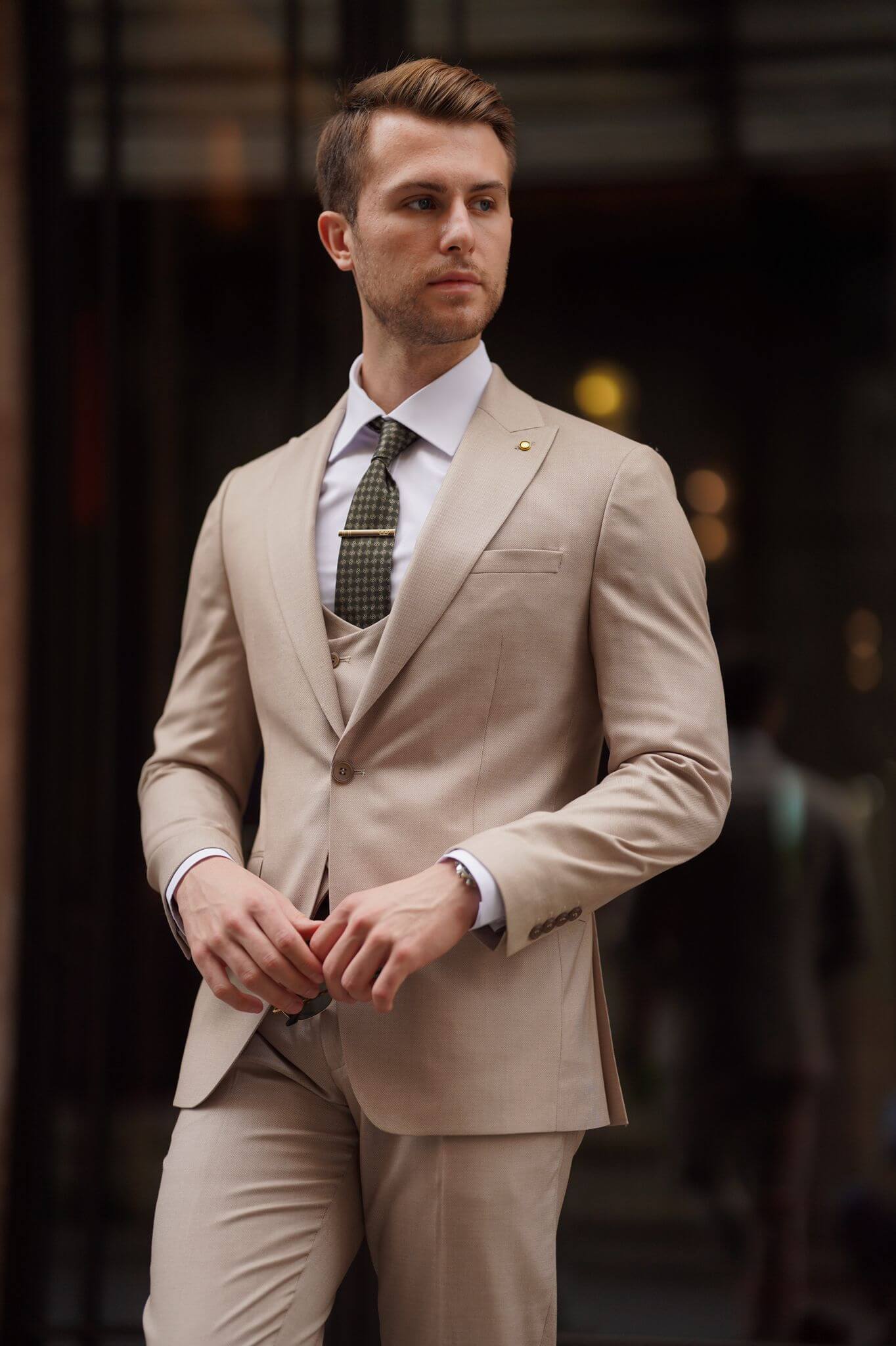 A Slim-Fit Beige Wool Suit on display.