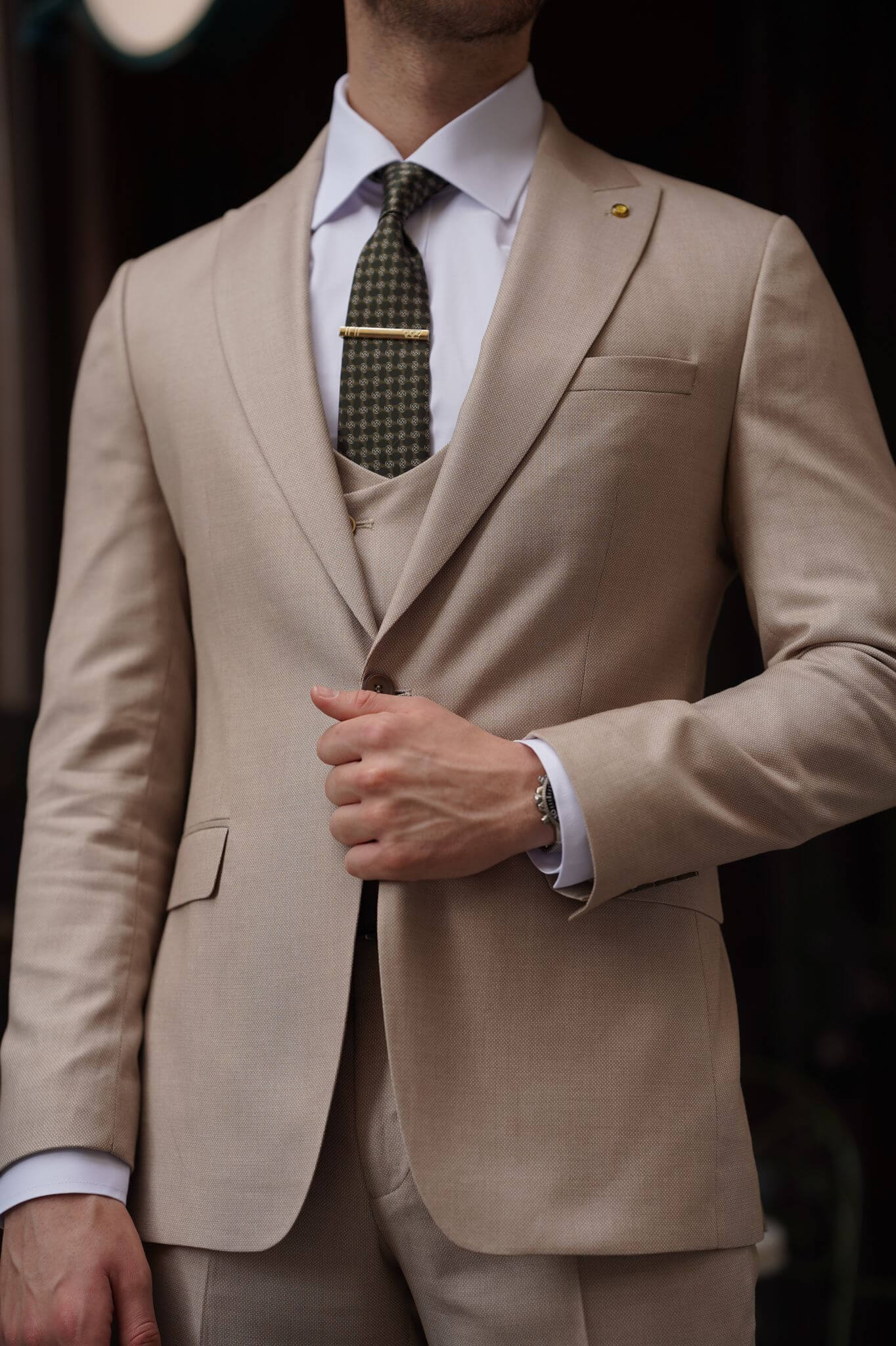 A Slim-Fit Beige Wool Suit on display.