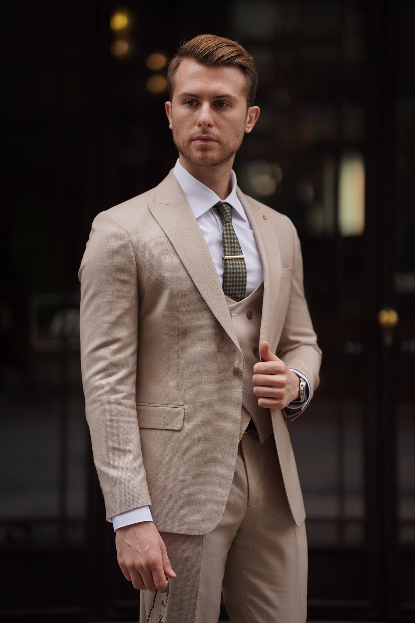 A Slim-Fit Beige Wool Suit on display.