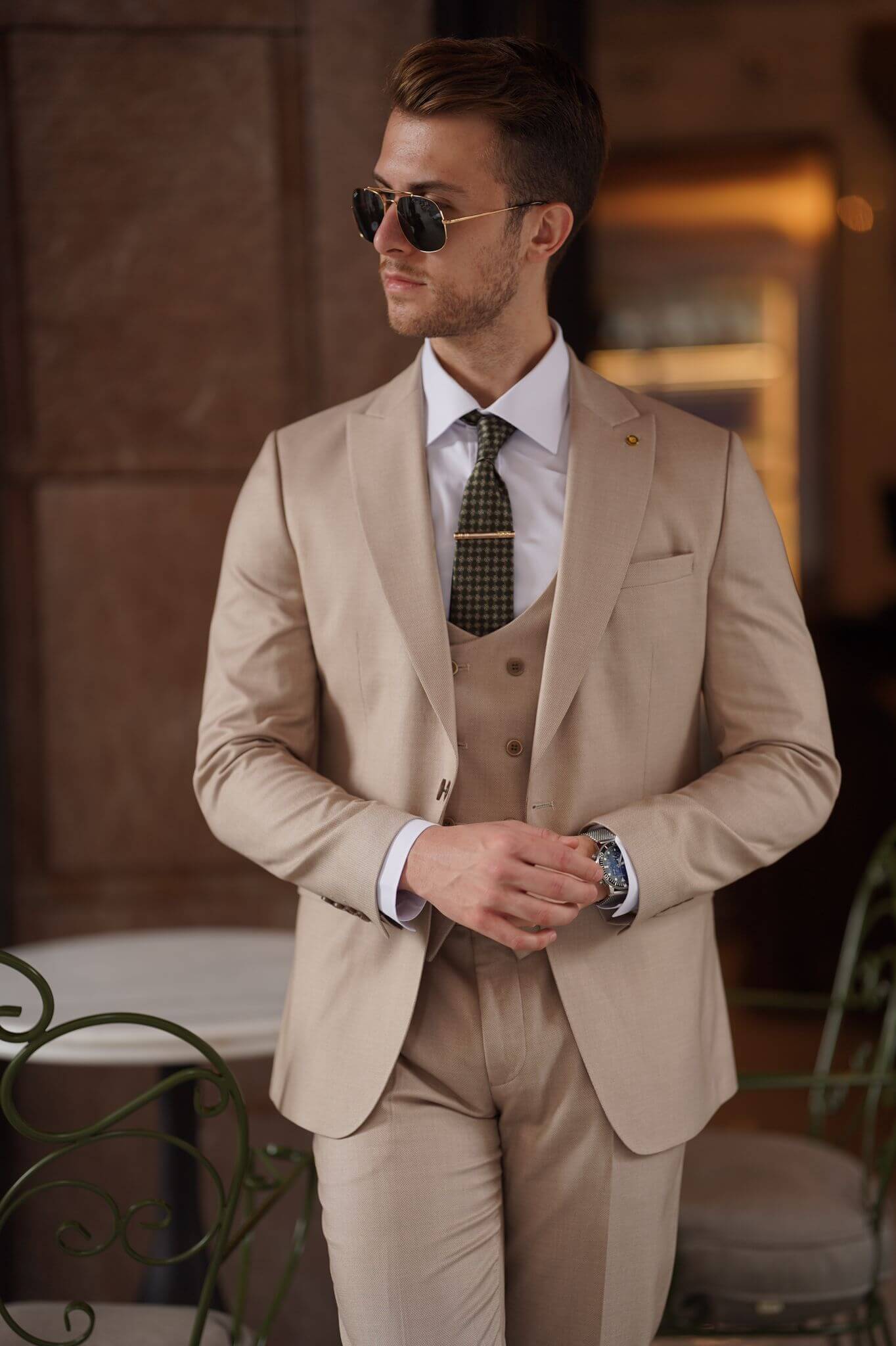 A Slim-Fit Beige Wool Suit on display.