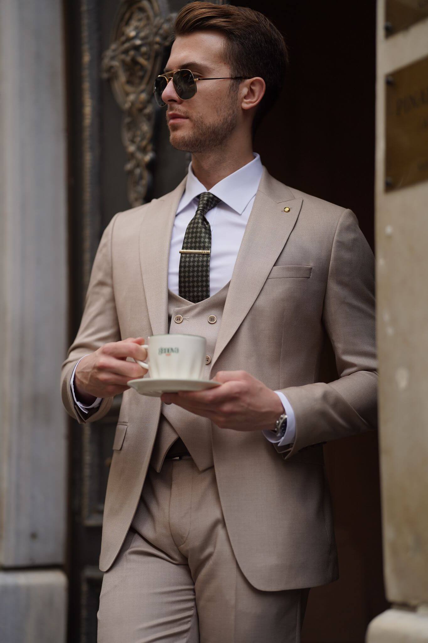 A Slim-Fit Beige Wool Suit on display.