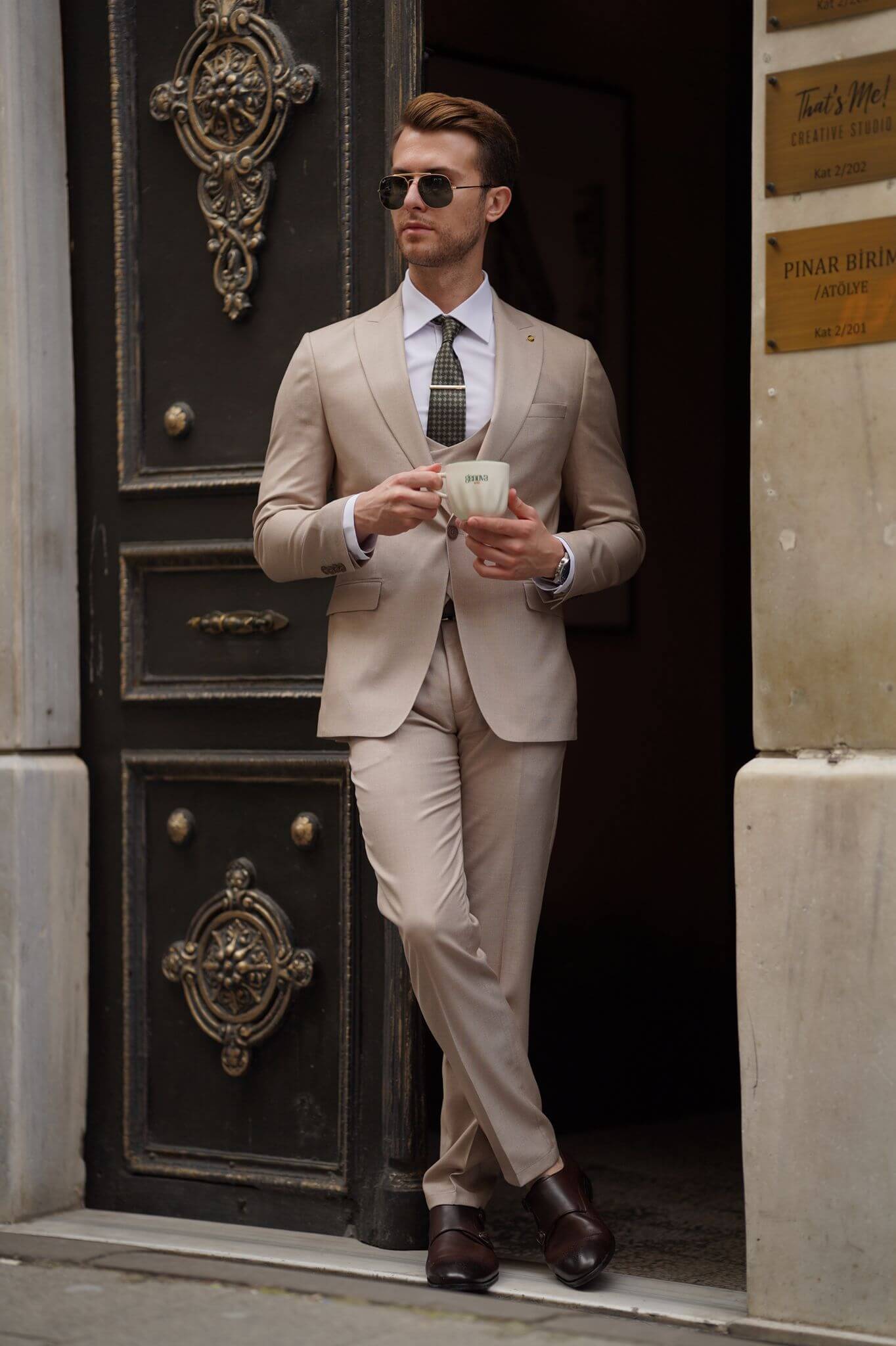A Slim-Fit Beige Wool Suit on display.