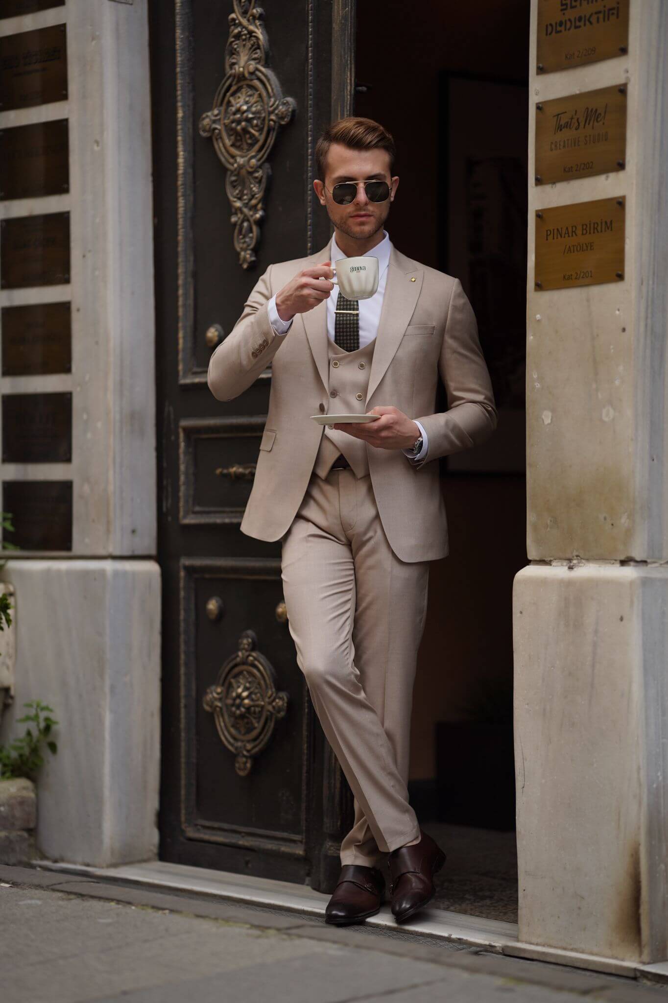 A Slim-Fit Beige Wool Suit on display.