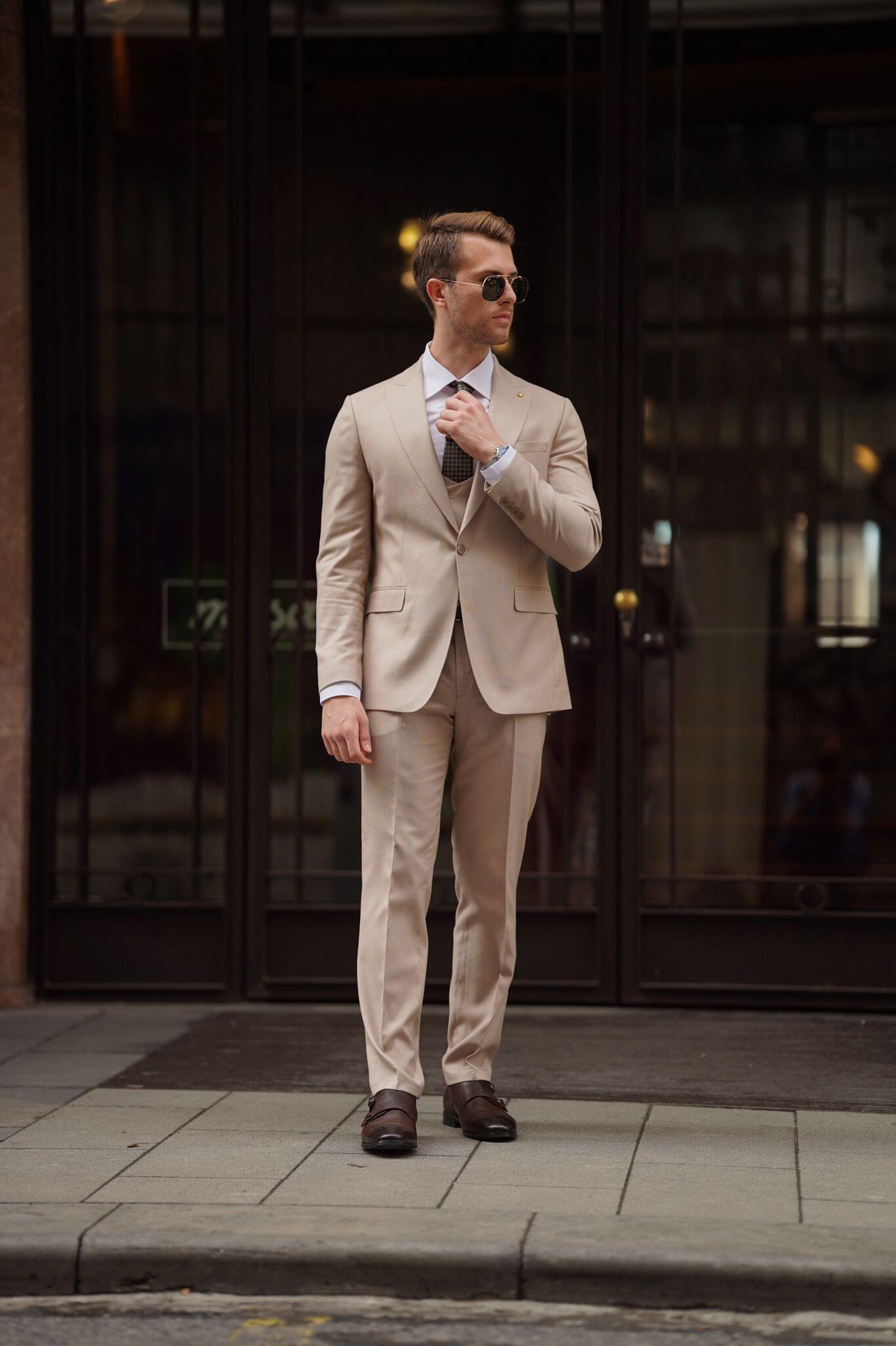 A Slim-Fit Beige Wool Suit on display.