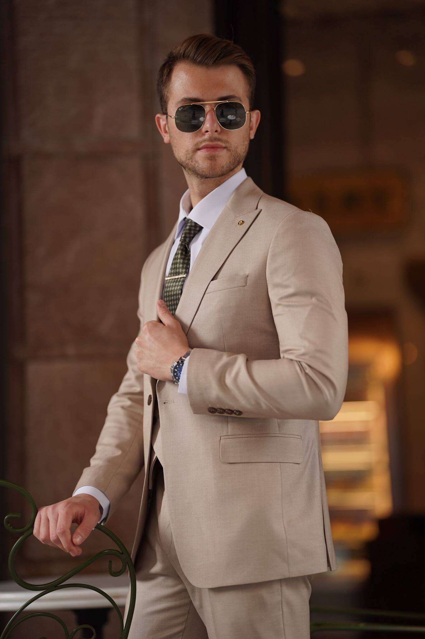 A Slim-Fit Beige Wool Suit on display.