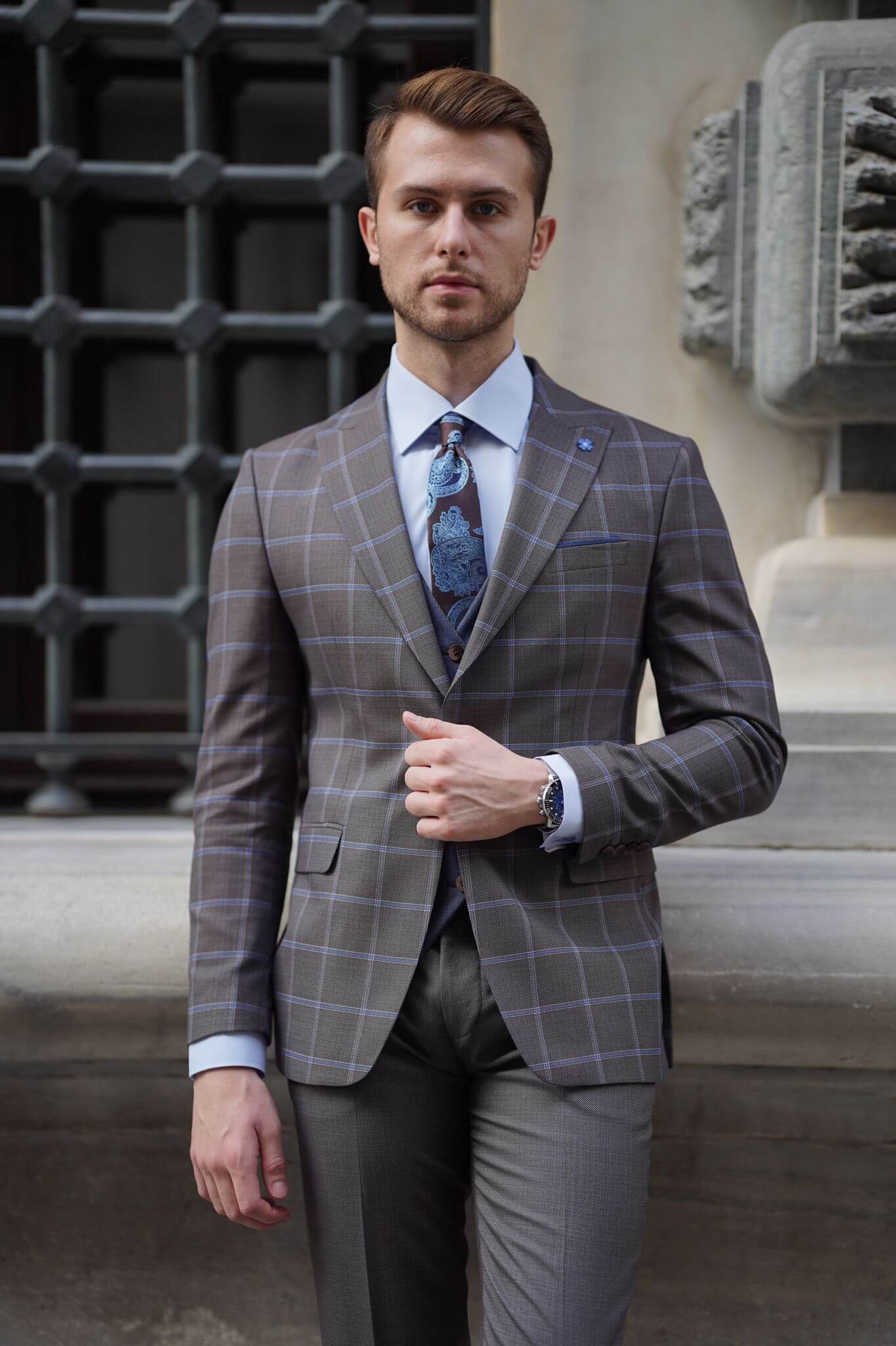 A Slim-Fit Plaid Brown Wool Combination Suit on display.