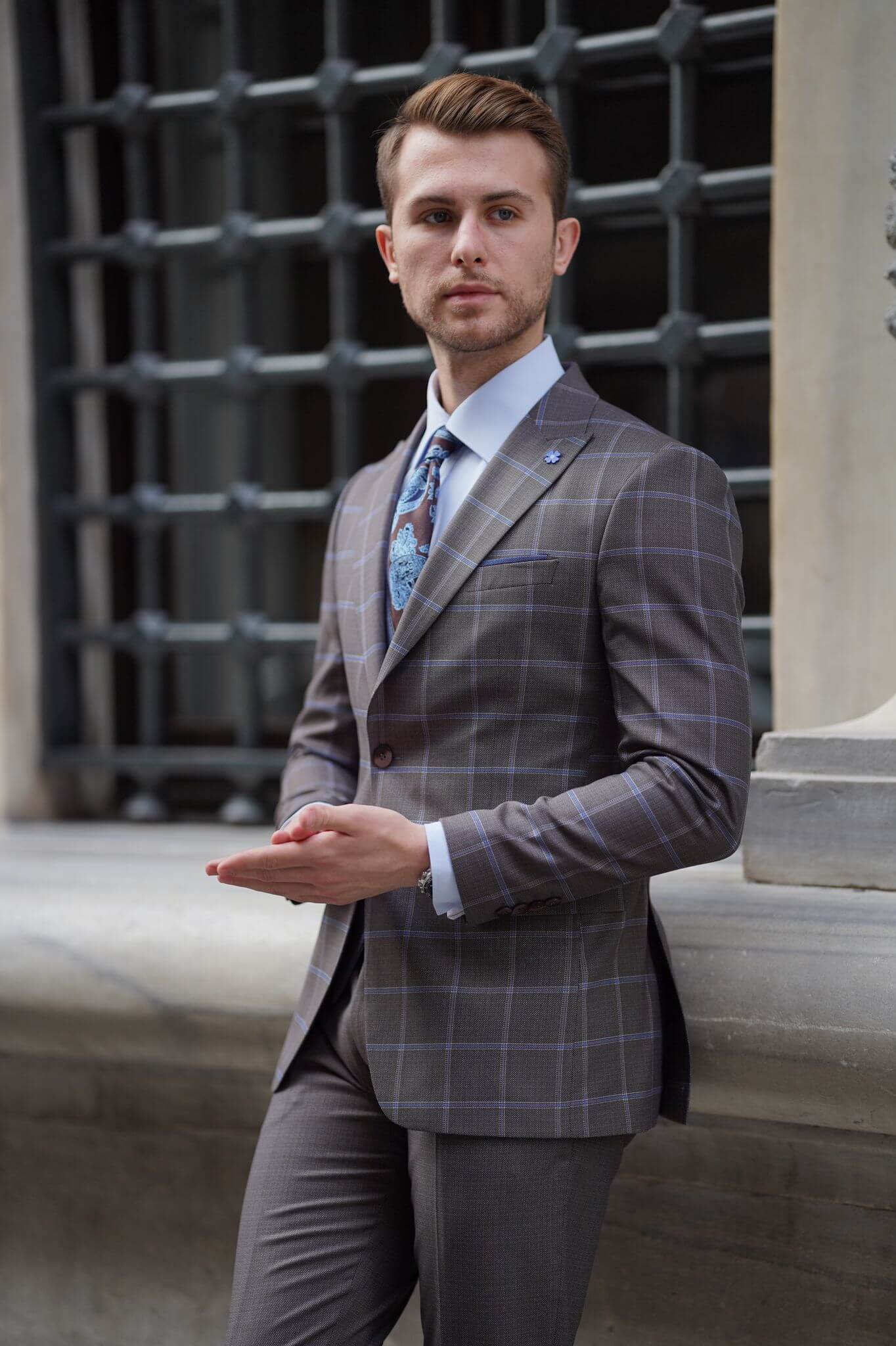 A Slim-Fit Plaid Brown Wool Combination Suit on display.