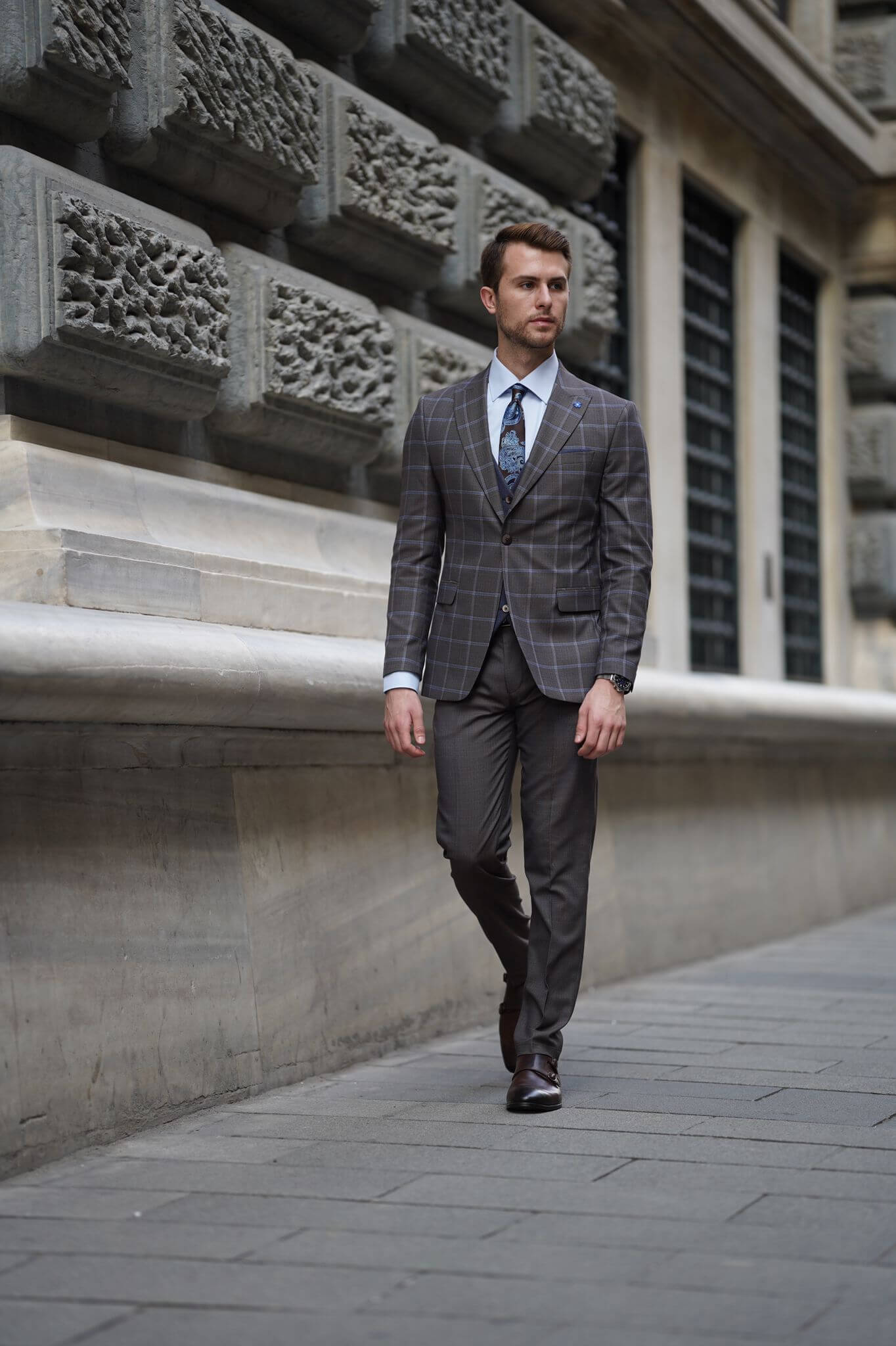 A Slim-Fit Plaid Brown Wool Combination Suit on display.
