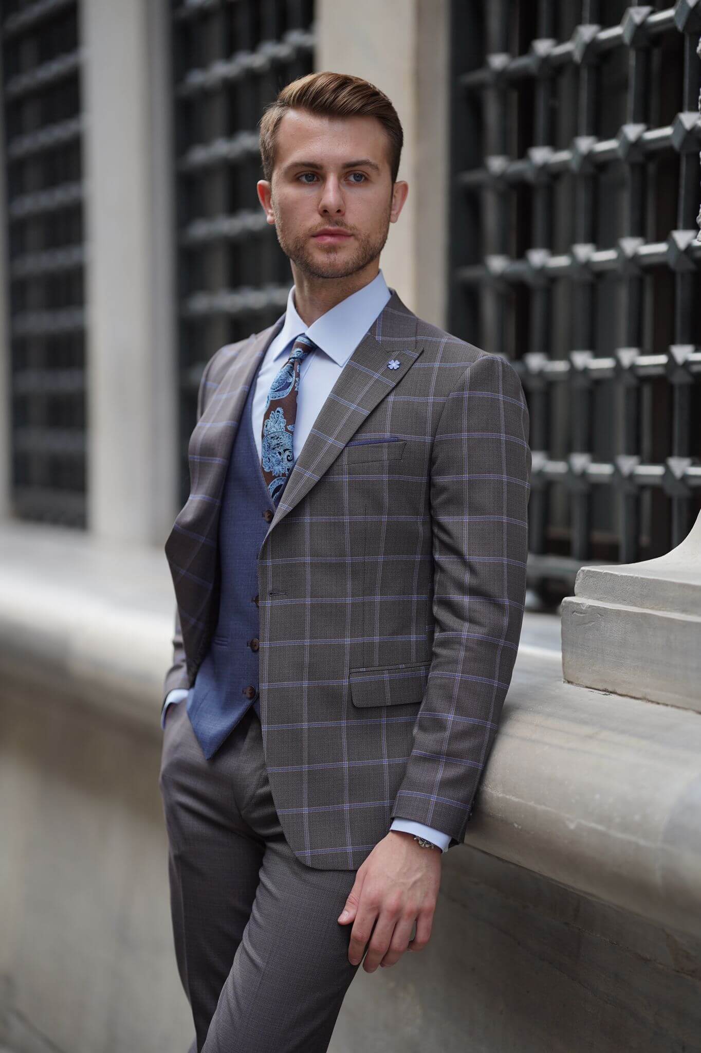 A Slim-Fit Plaid Brown Wool Combination Suit on display.