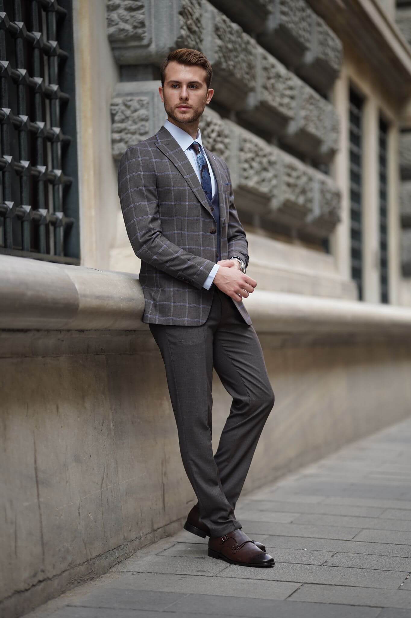 A Slim-Fit Plaid Brown Wool Combination Suit on display.