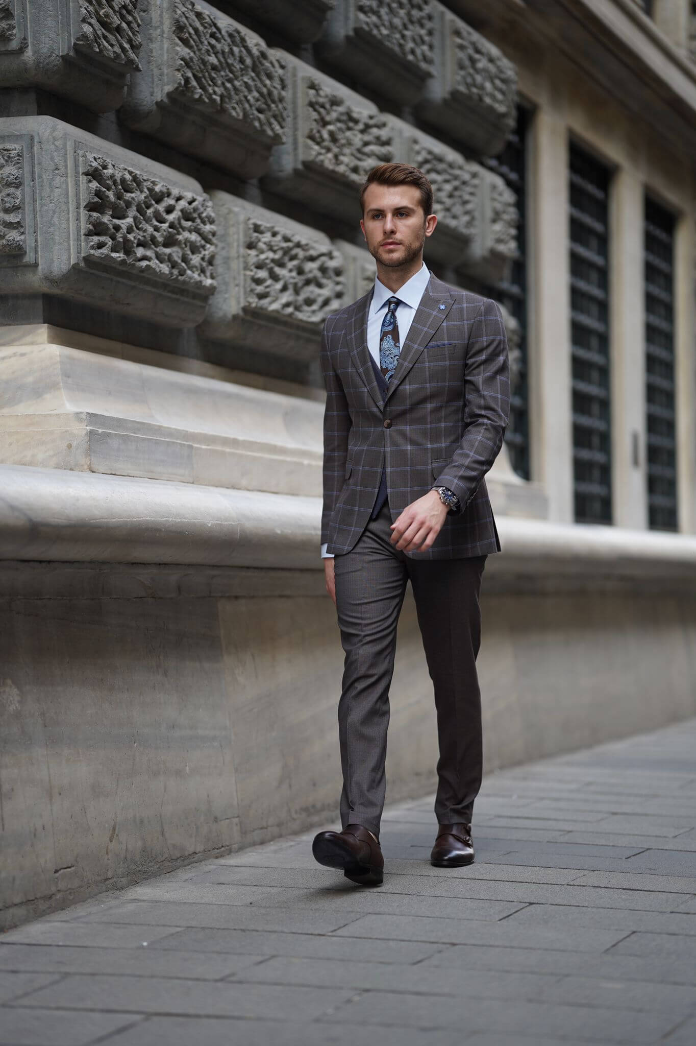 A Slim-Fit Plaid Brown Wool Combination Suit on display.