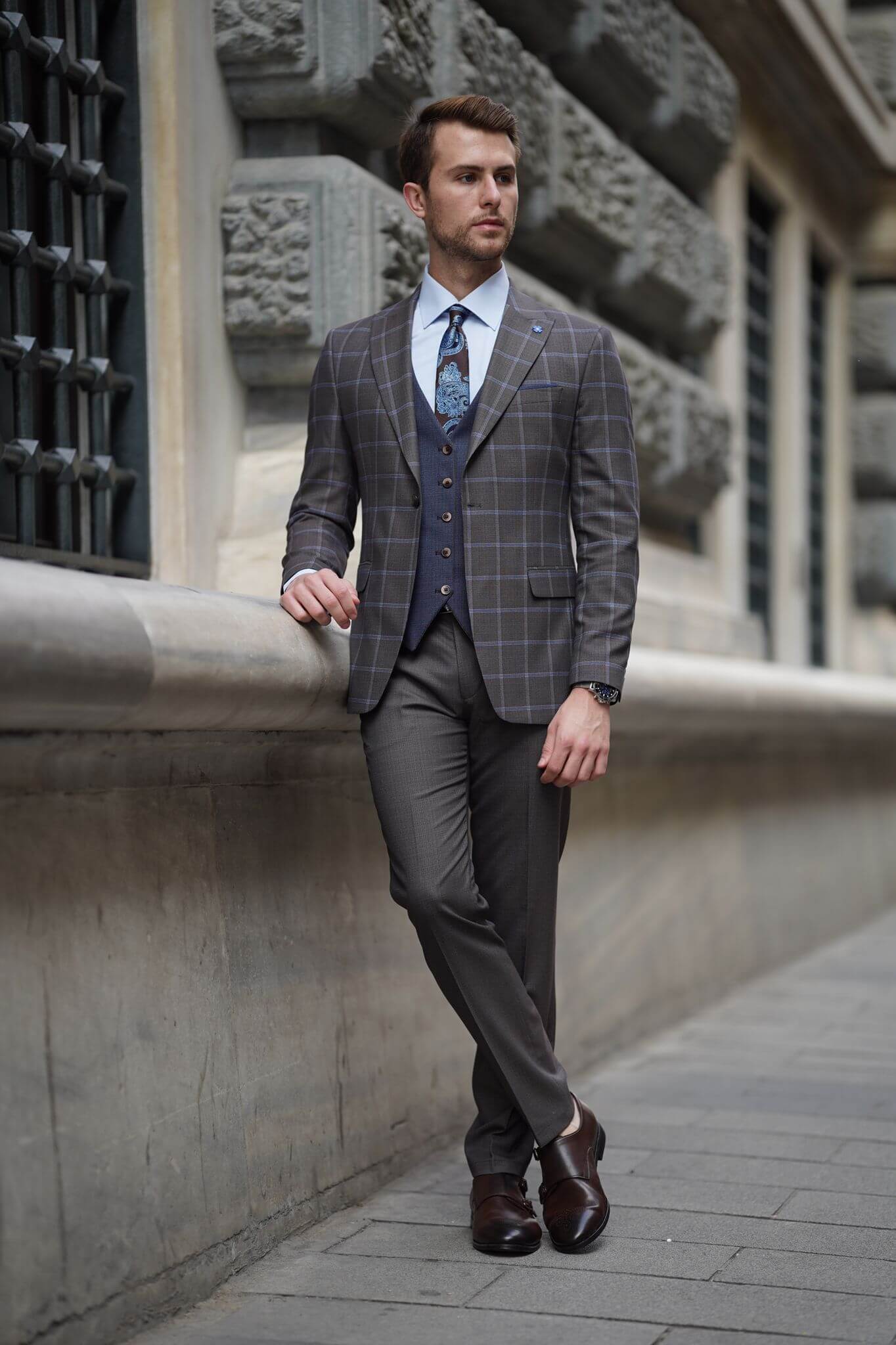 A Slim-Fit Plaid Brown Wool Combination Suit on display.