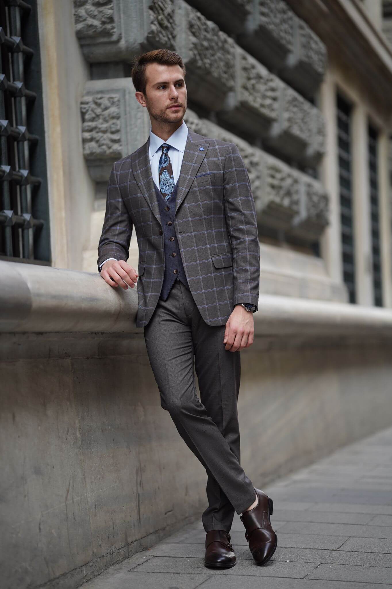 A Slim-Fit Plaid Brown Wool Combination Suit on display.