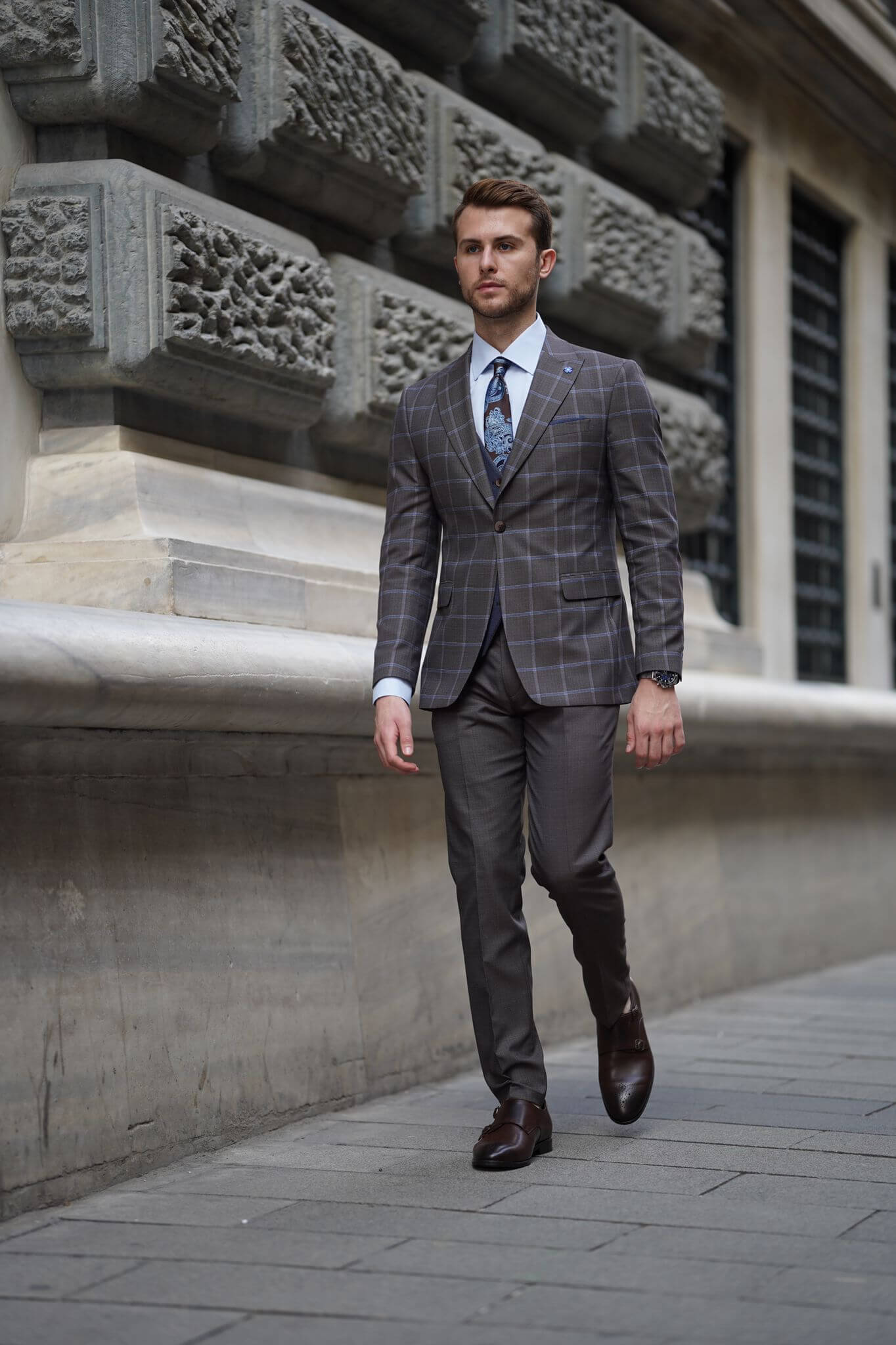 A Slim-Fit Plaid Brown Wool Combination Suit on display.