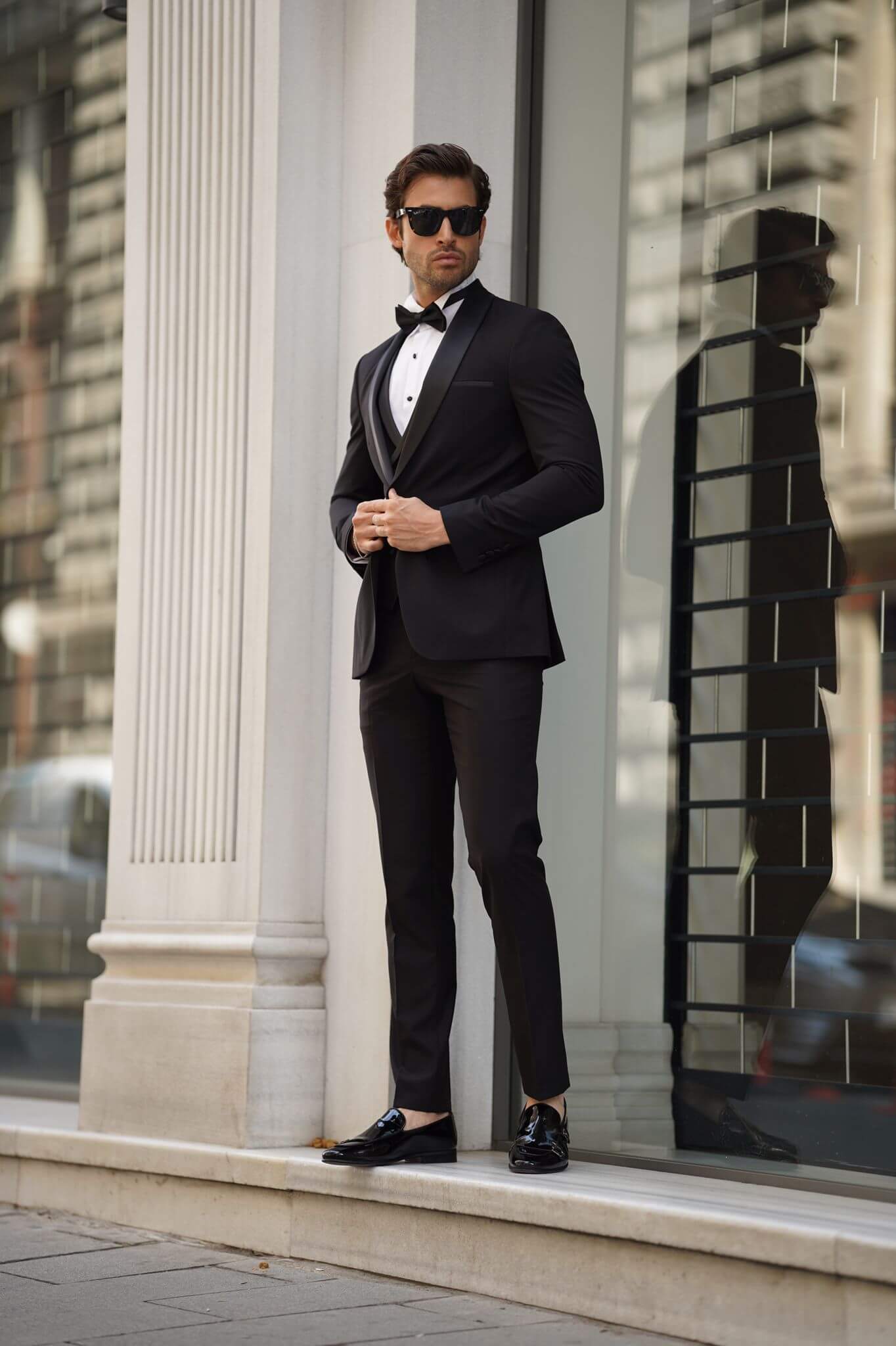 A Slim-Fit Shawl Collar Black Tuxedo Suit on display.