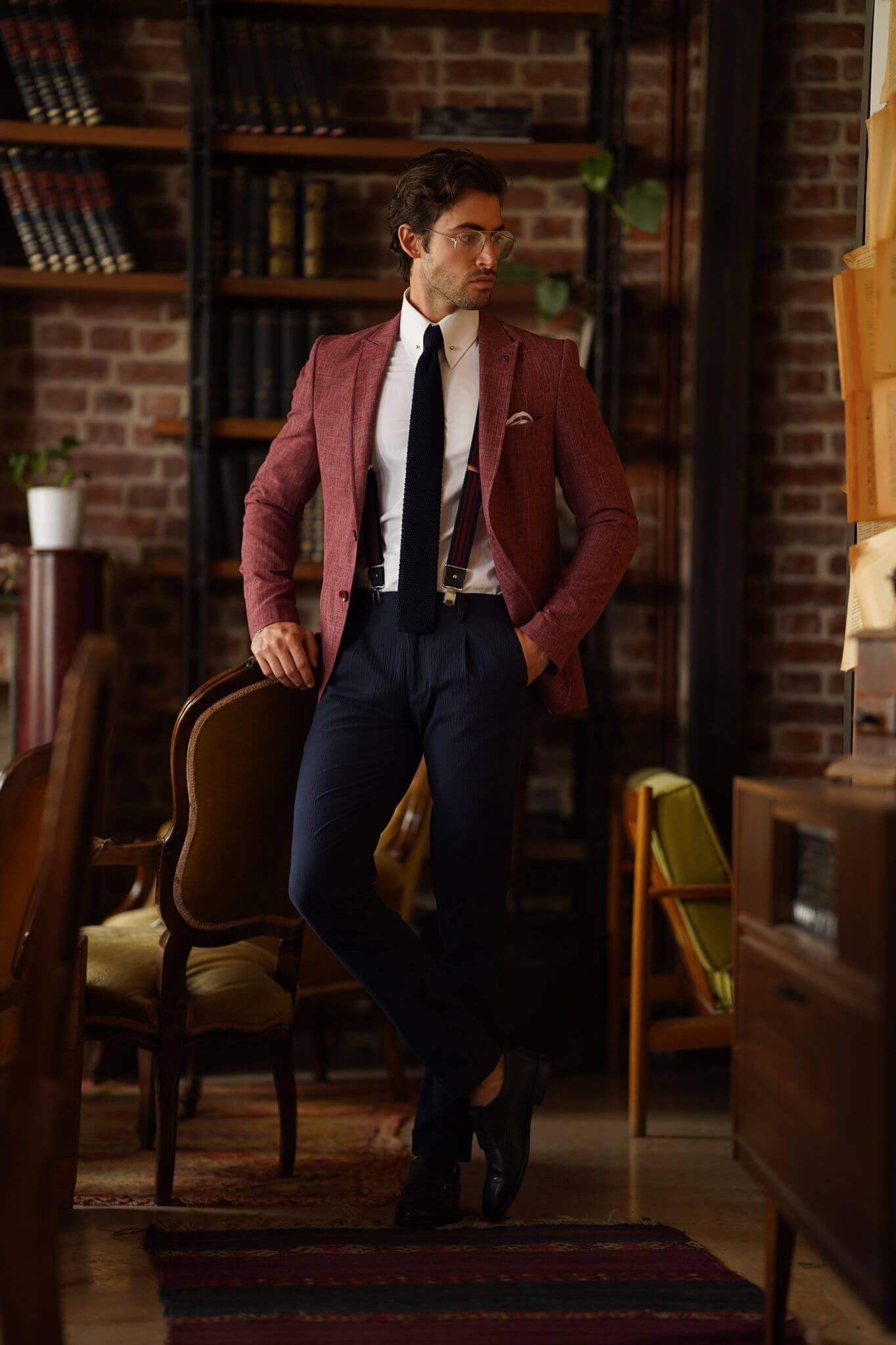 A Slim-Fit Self patterned Cotton Claret Red Blazer on display.