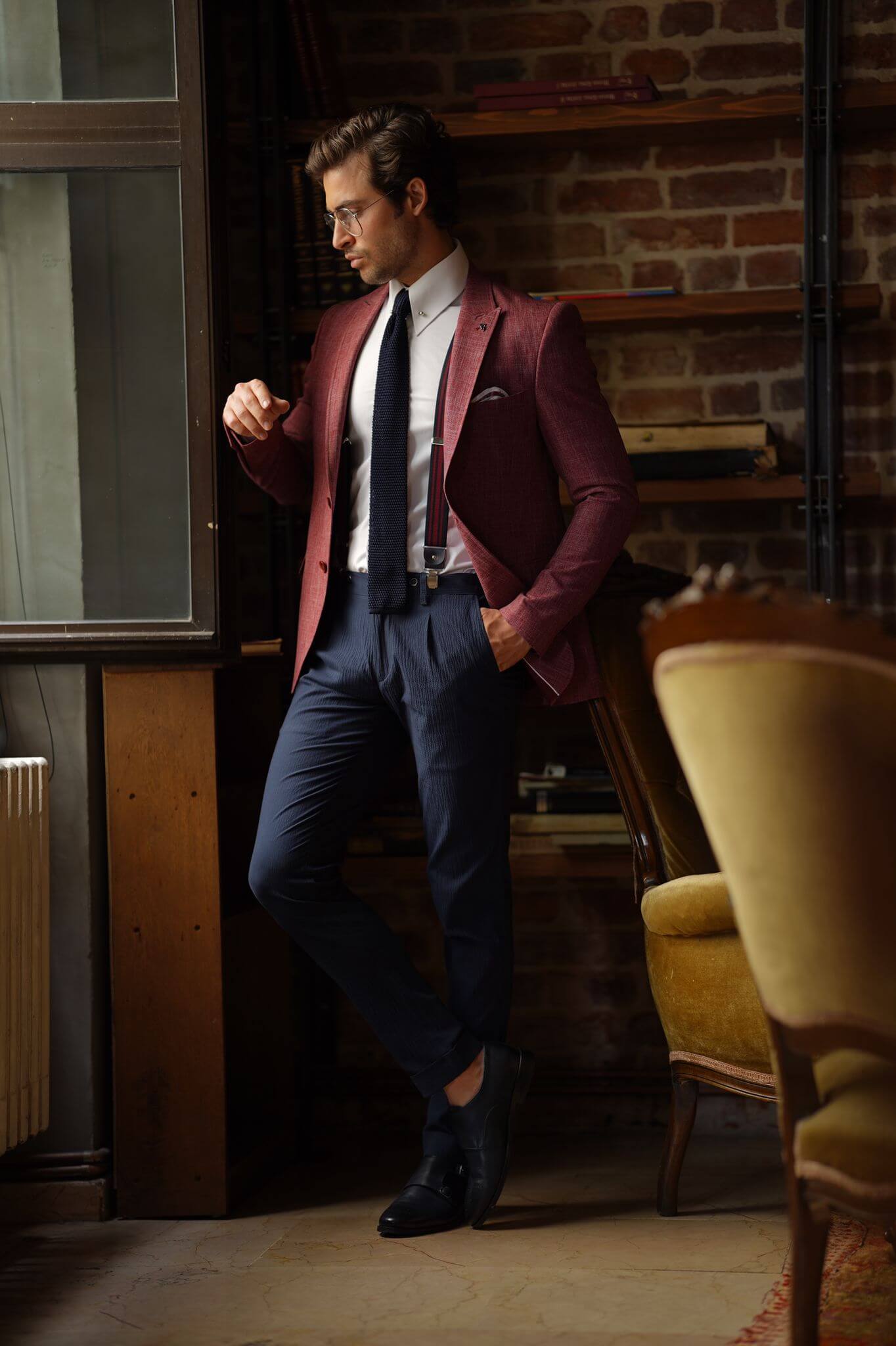 A Slim-Fit Self patterned Cotton Claret Red Blazer on display.