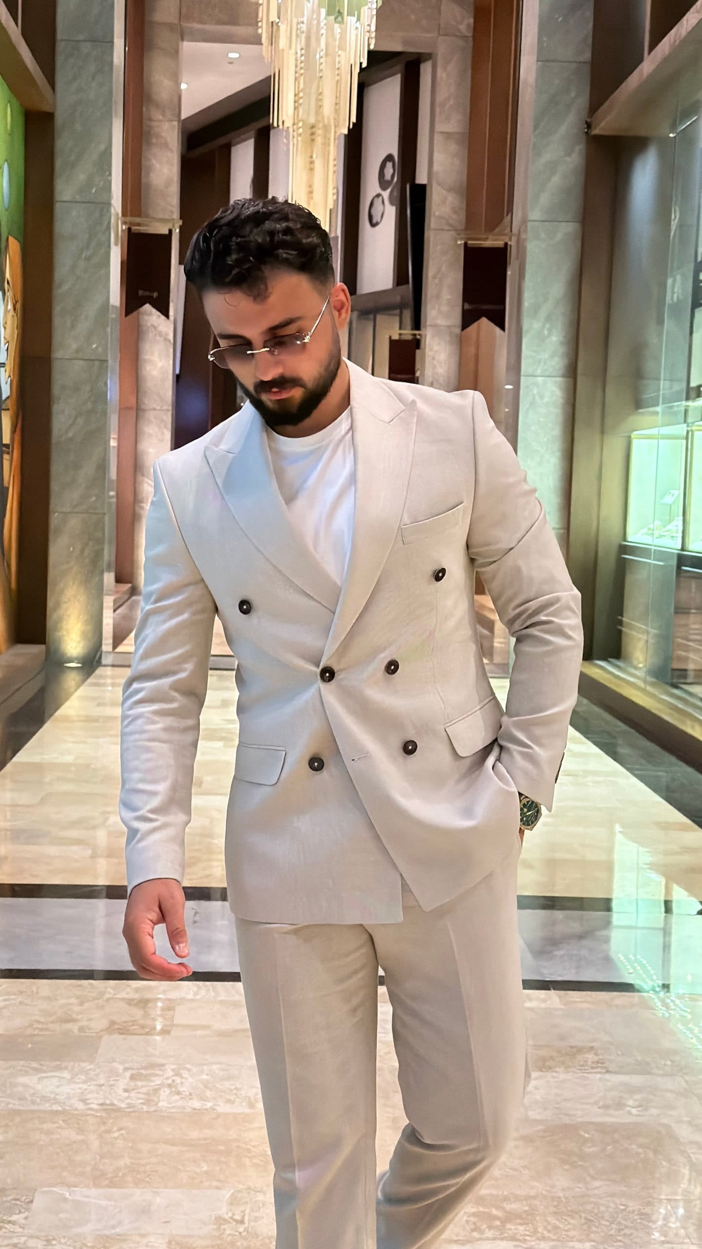Beige slim fit suit showing peak lapel and contrast buttons
