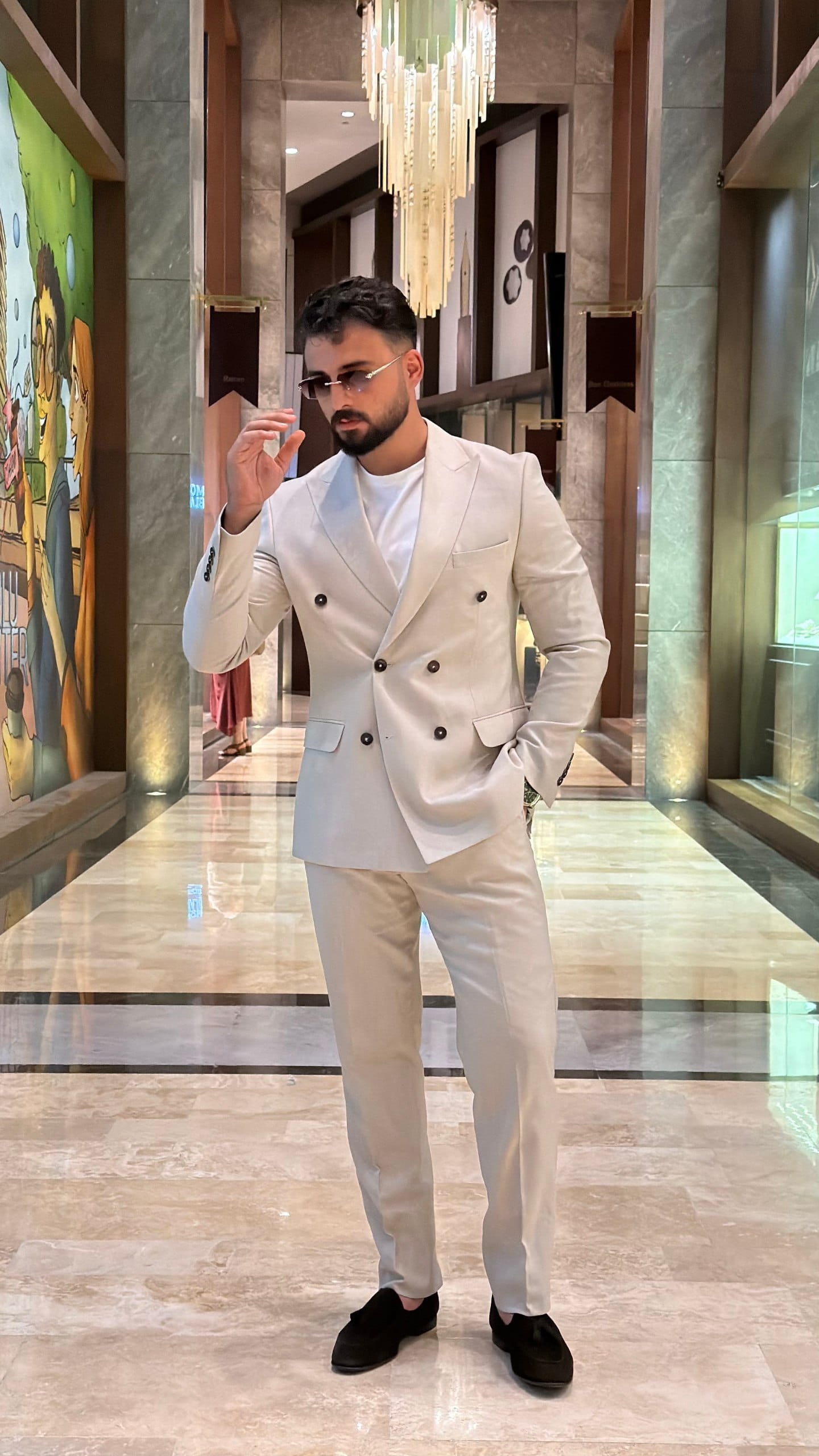 Full-length beige wedding suit with matching trousers