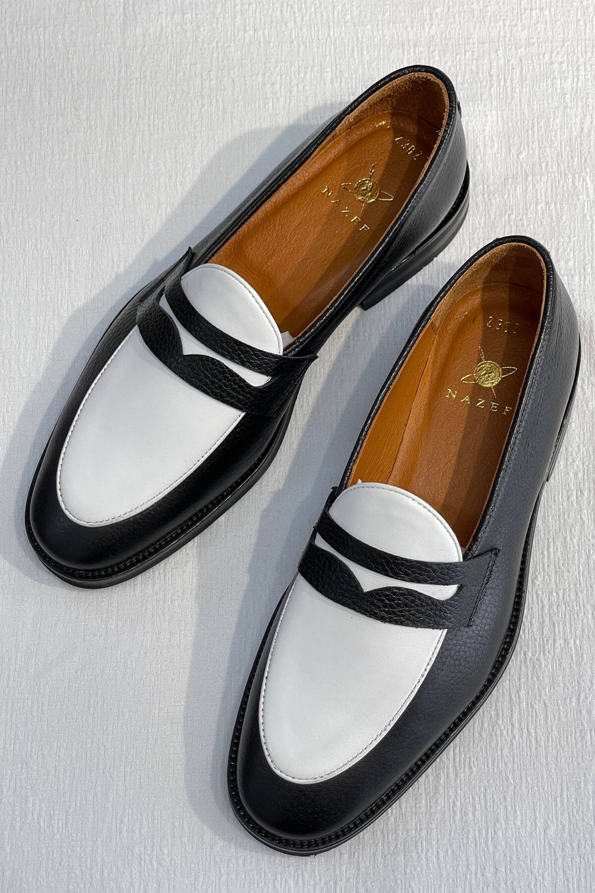 Bicolor Leather Penny Loafers in Black and White