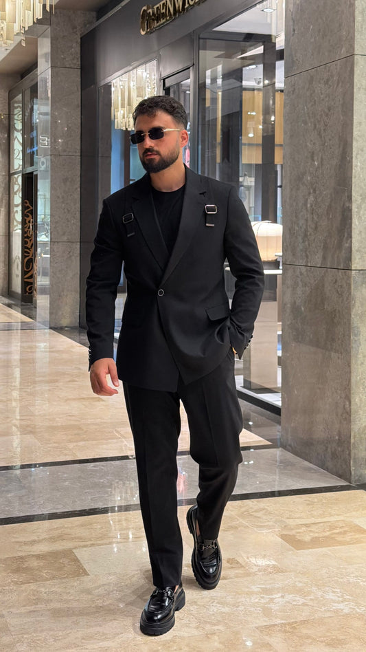 Men's black slim fit two-piece suit with buckle-strap detail