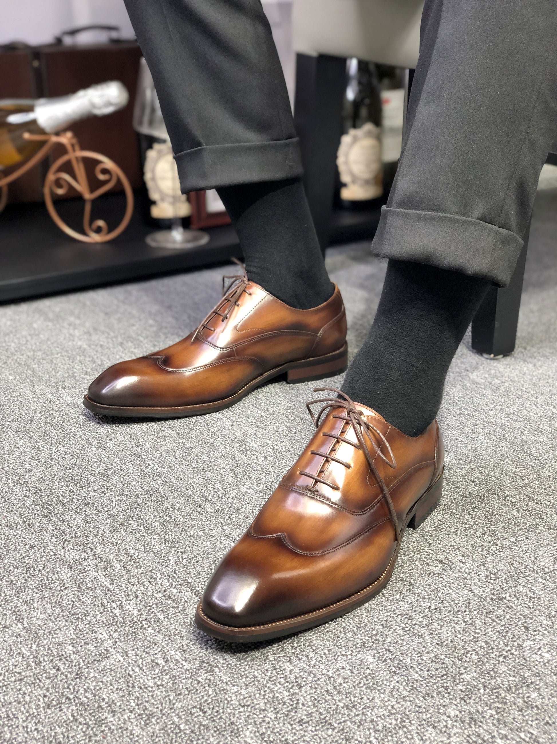 A pair of polished Formal Brown Leather Oxford Shoes, showcasing a sleek and elegant design, perfect for formal wear and professional settings.