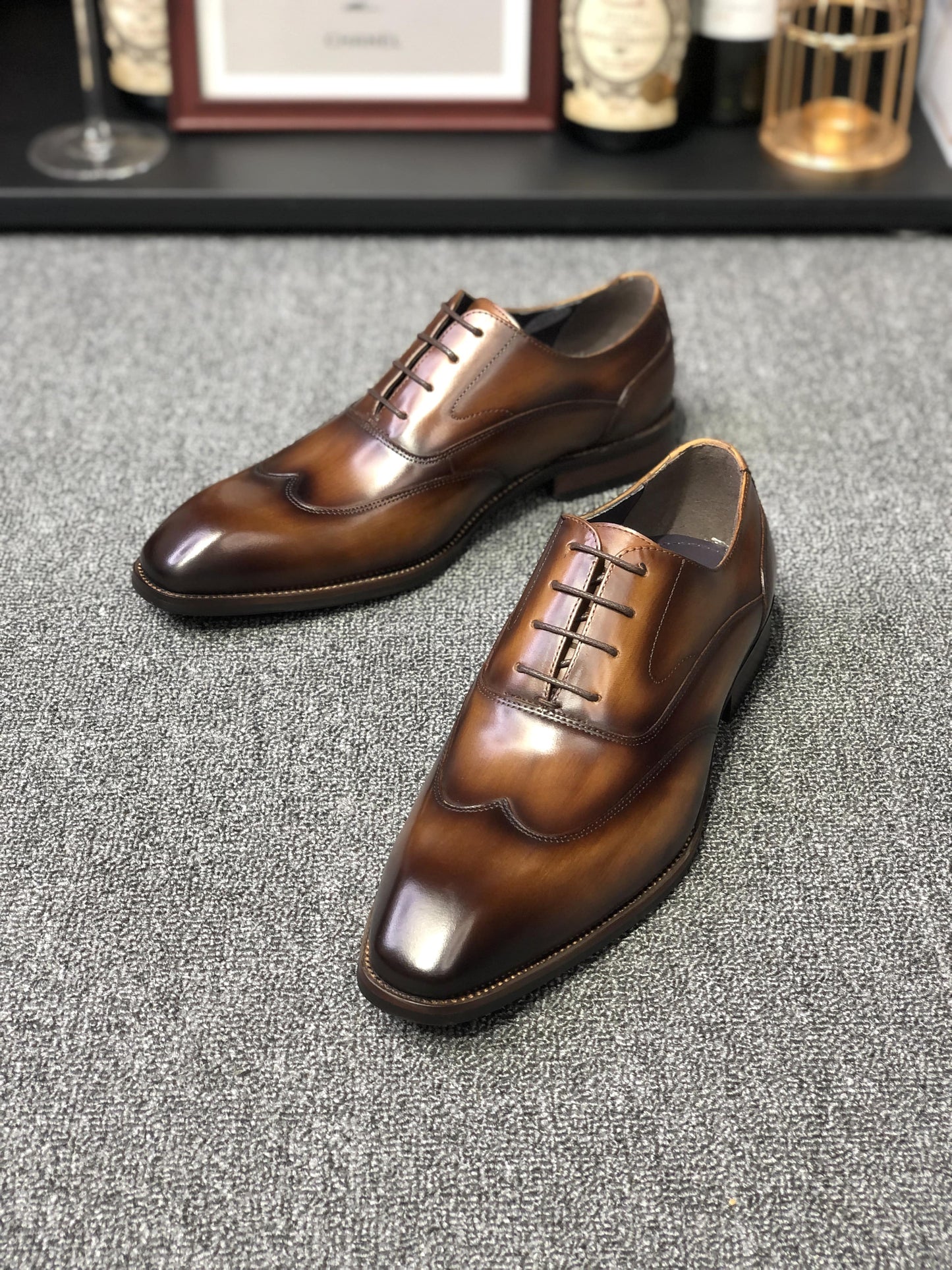 A pair of polished Formal Brown Leather Oxford Shoes, showcasing a sleek and elegant design, perfect for formal wear and professional settings.