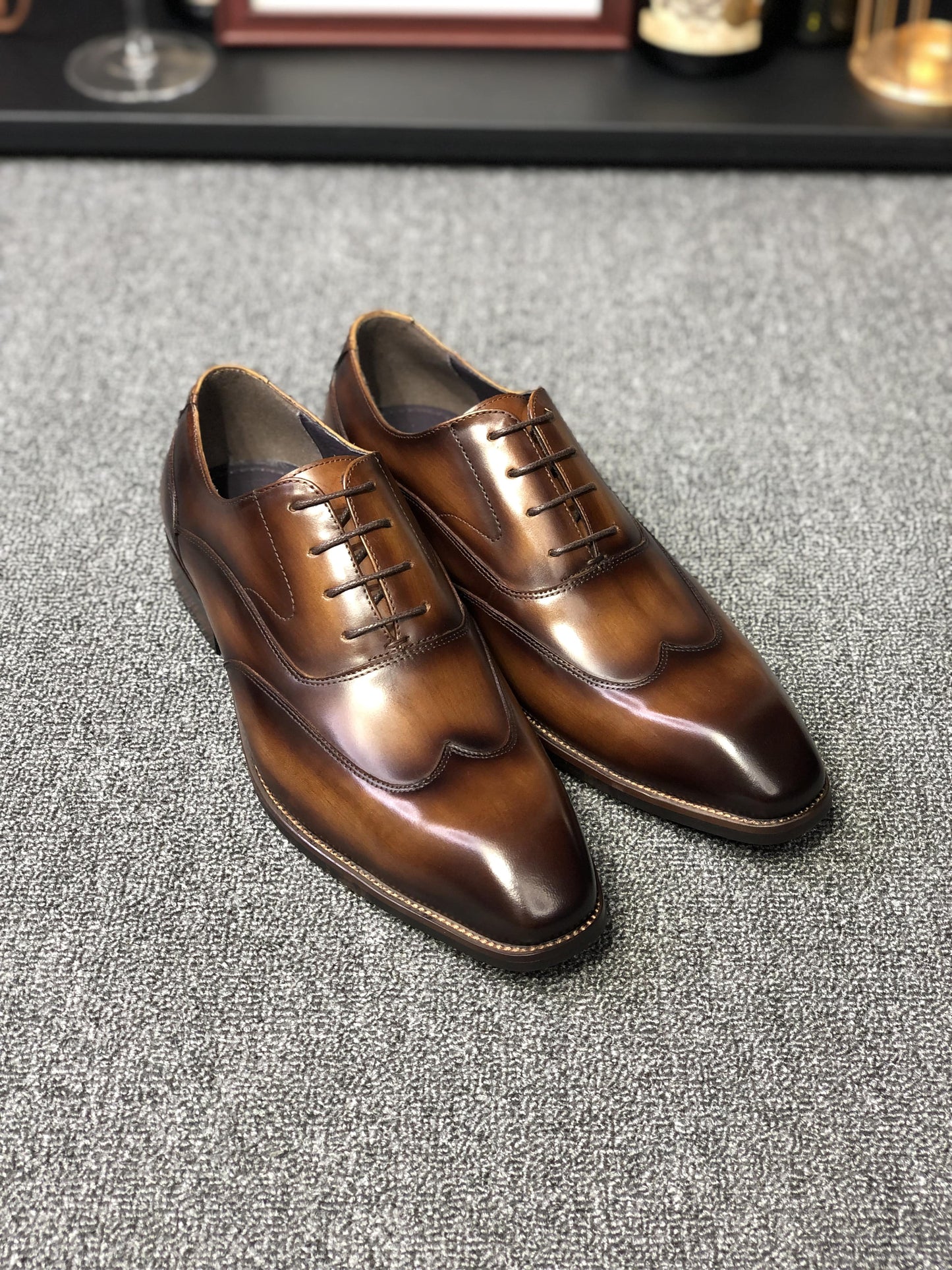 A pair of polished Formal Brown Leather Oxford Shoes, showcasing a sleek and elegant design, perfect for formal wear and professional settings.