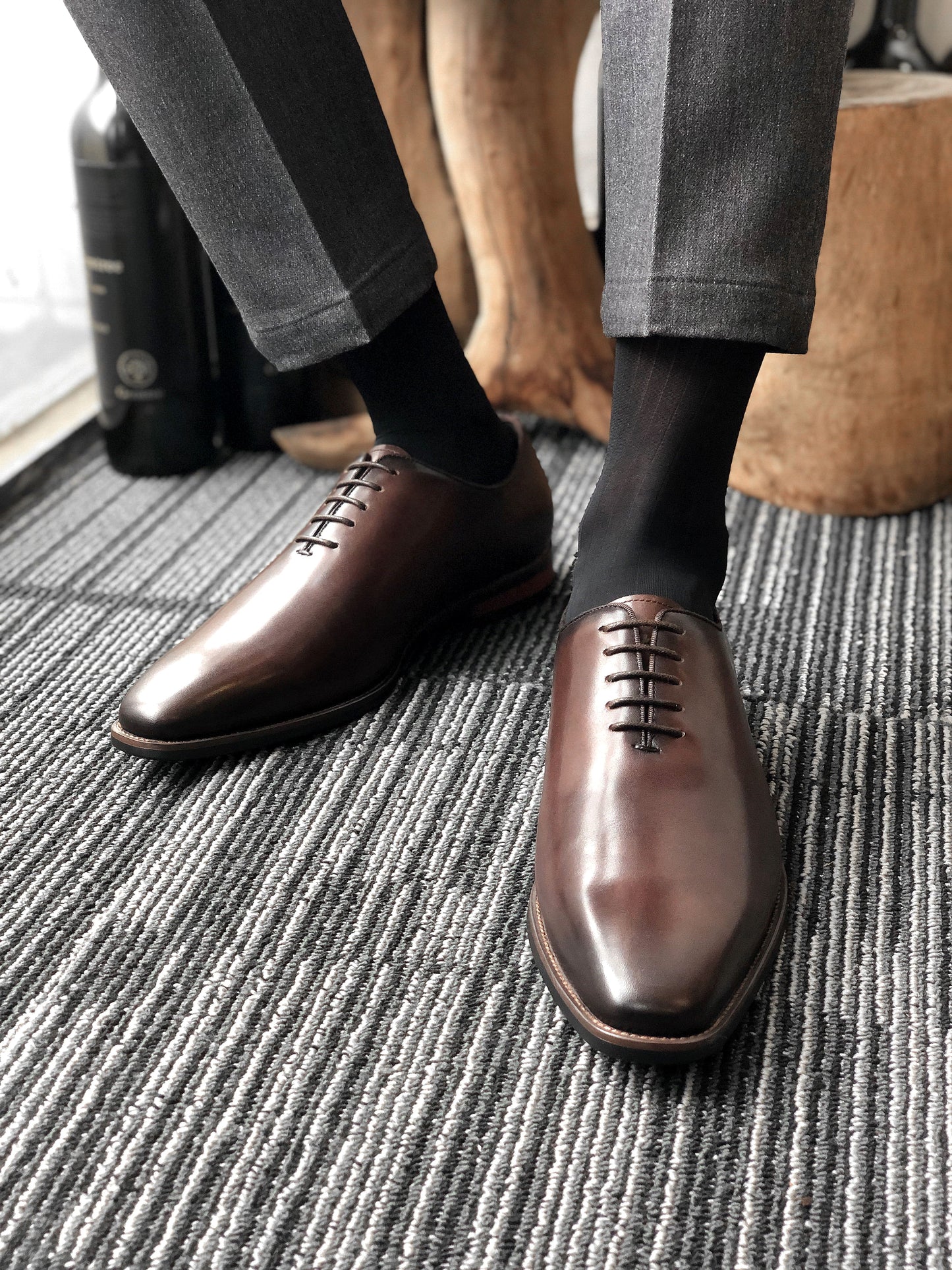 A pair of handcrafted Brown Leather Oxford Shoes, featuring a polished finish and sleek design, ideal for formal wear and business attire.