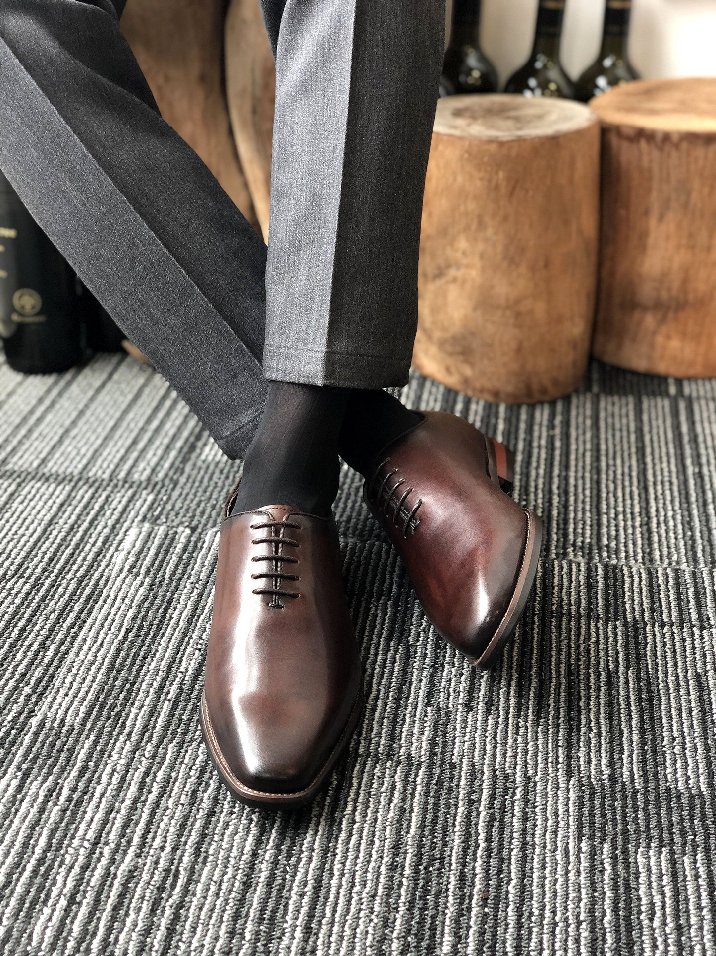 A pair of handcrafted Brown Leather Oxford Shoes, featuring a polished finish and sleek design, ideal for formal wear and business attire.