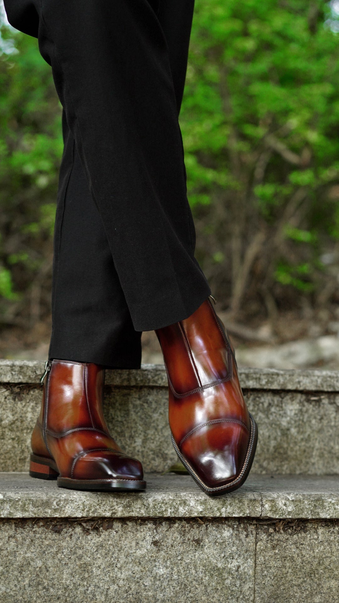 A pair of handcrafted Chestnut Leather Boots with a polished finish, featuring a sleek and elegant design, perfect for formal and business wear.