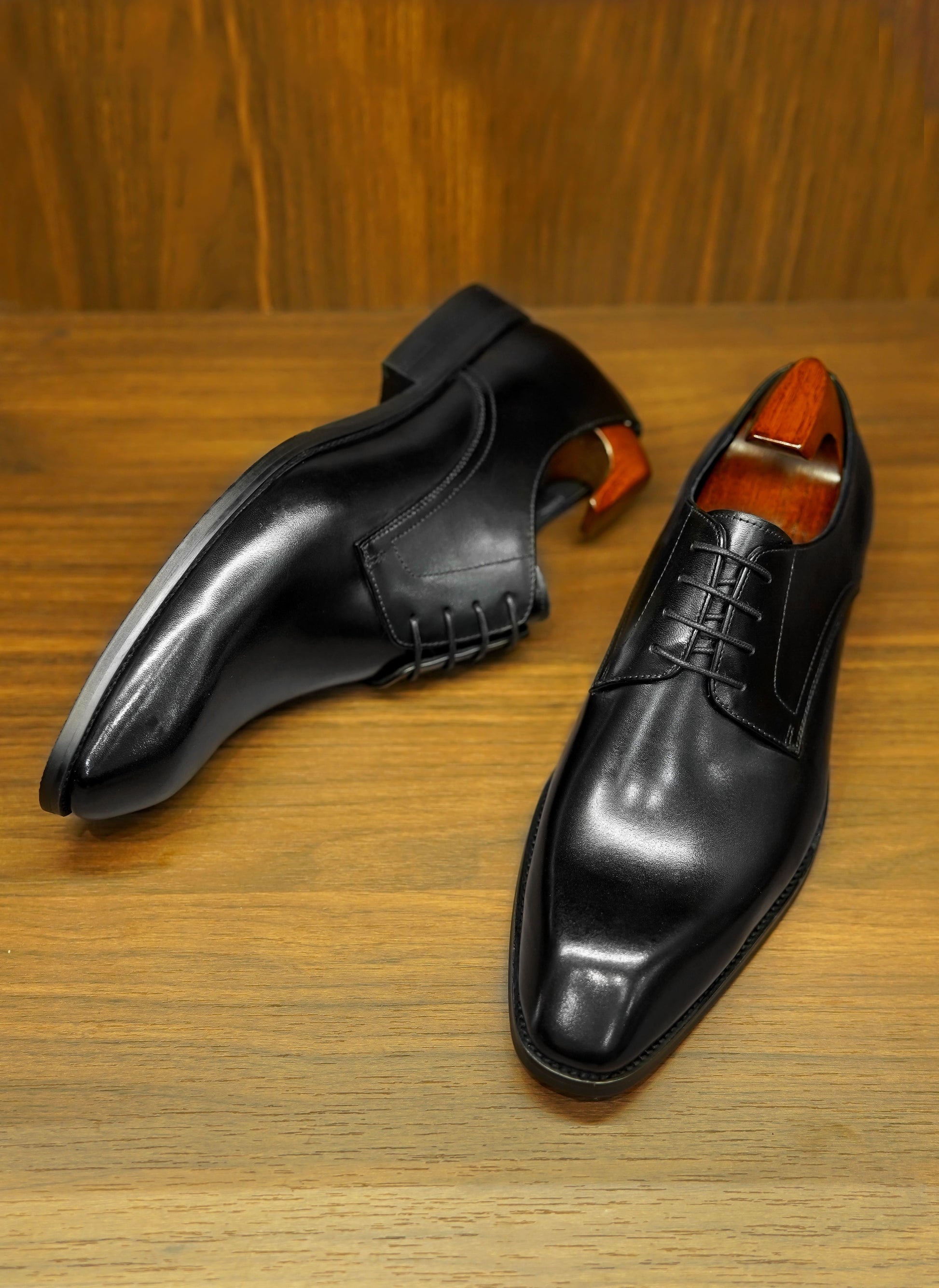 A pair of Classic Black Derby Shoes, crafted from premium leather, perfect for men’s formal and business wear.