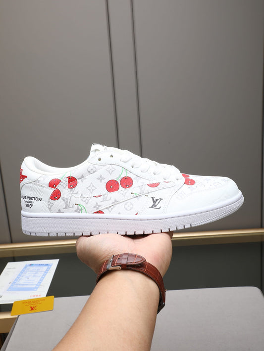 A white Louis Vuitton sneaker with cherry and monogram patterns.