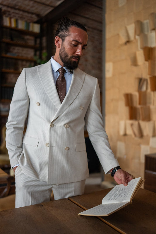 Men’s beige double-breasted slim fit suit with peak lapels, front view