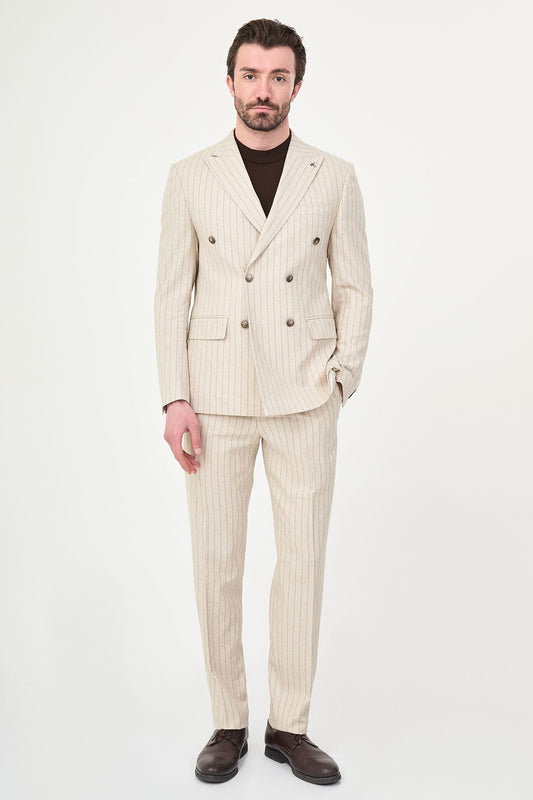 Man wearing a beige pinstripe suit on a white background