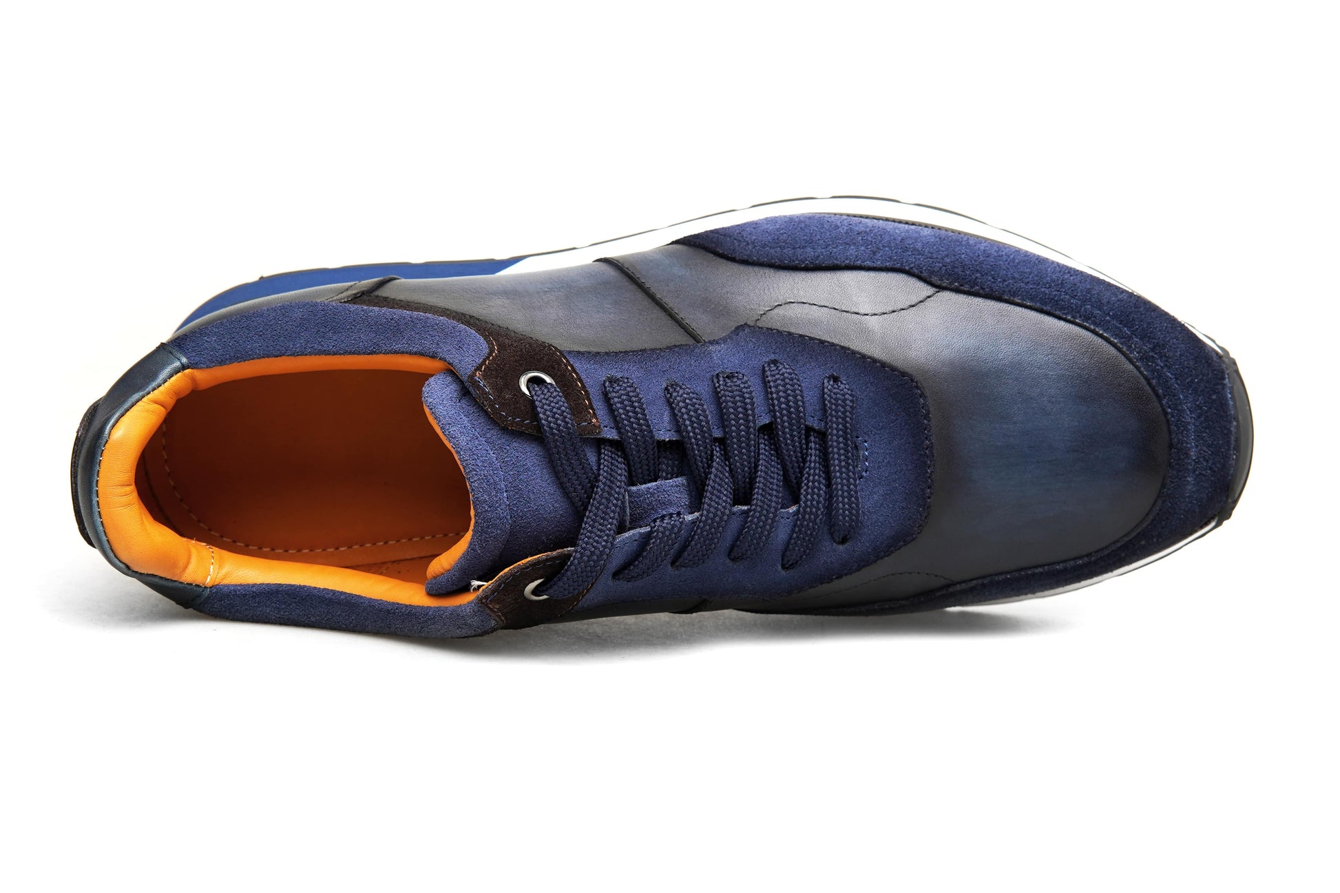 Blue sneaker with orange lining on a white background