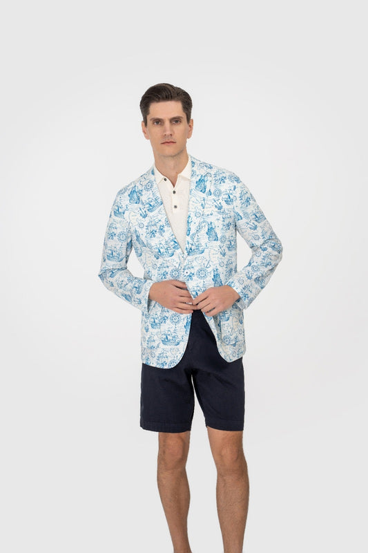 Man wearing a floral patterned shirt and navy shorts on a white background