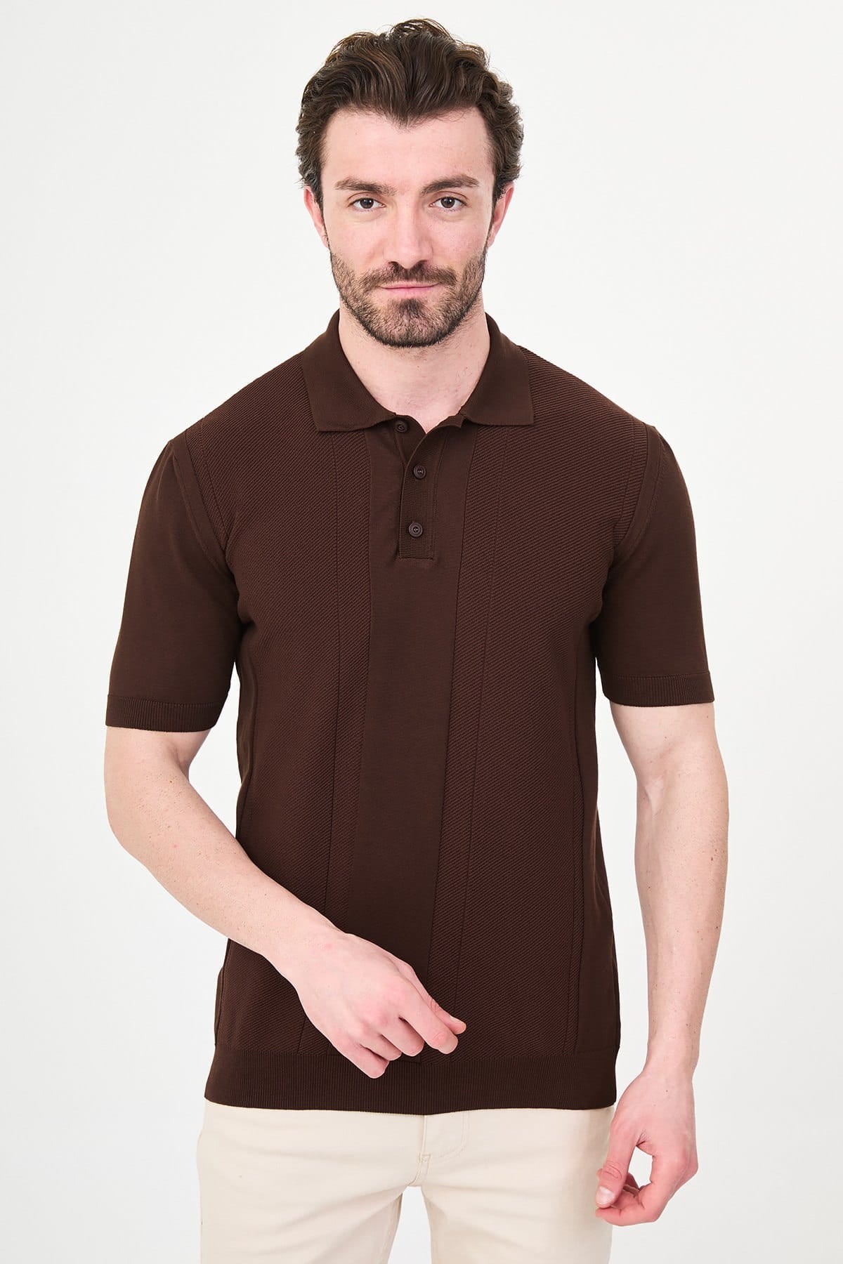 Man wearing a brown polo shirt against a white background