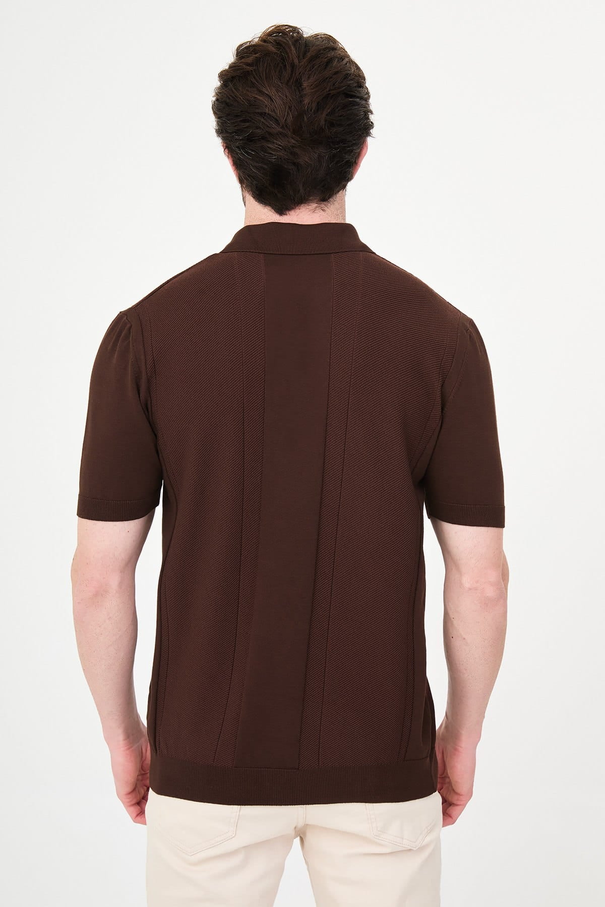 Man wearing a brown polo shirt on a white background