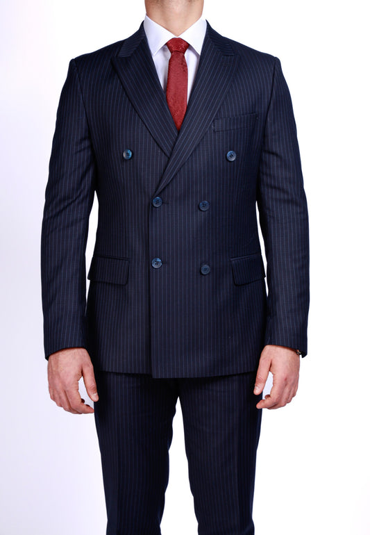 Navy pinstripe suit with a red tie on a white background
