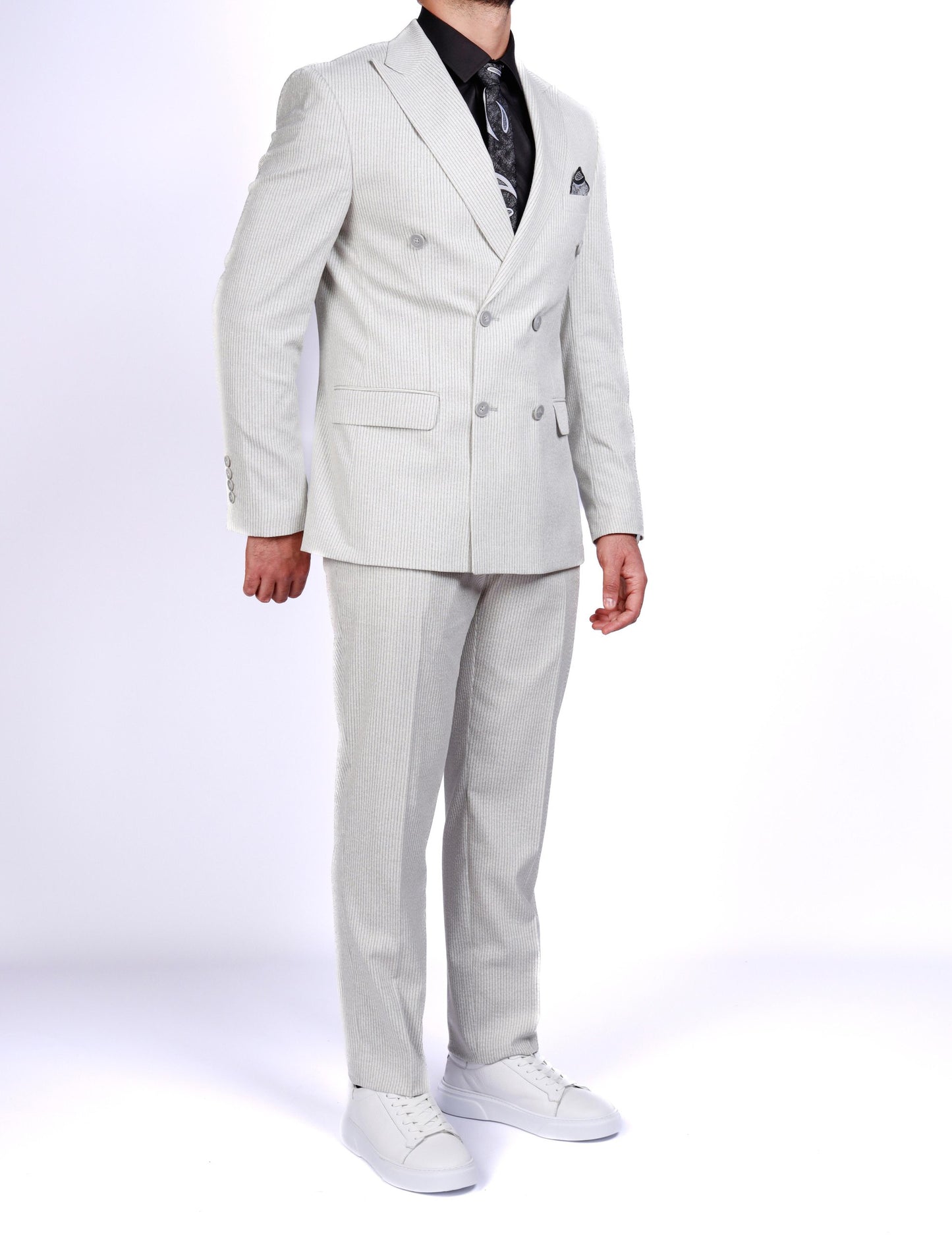 Light gray suit worn by a person on a white background