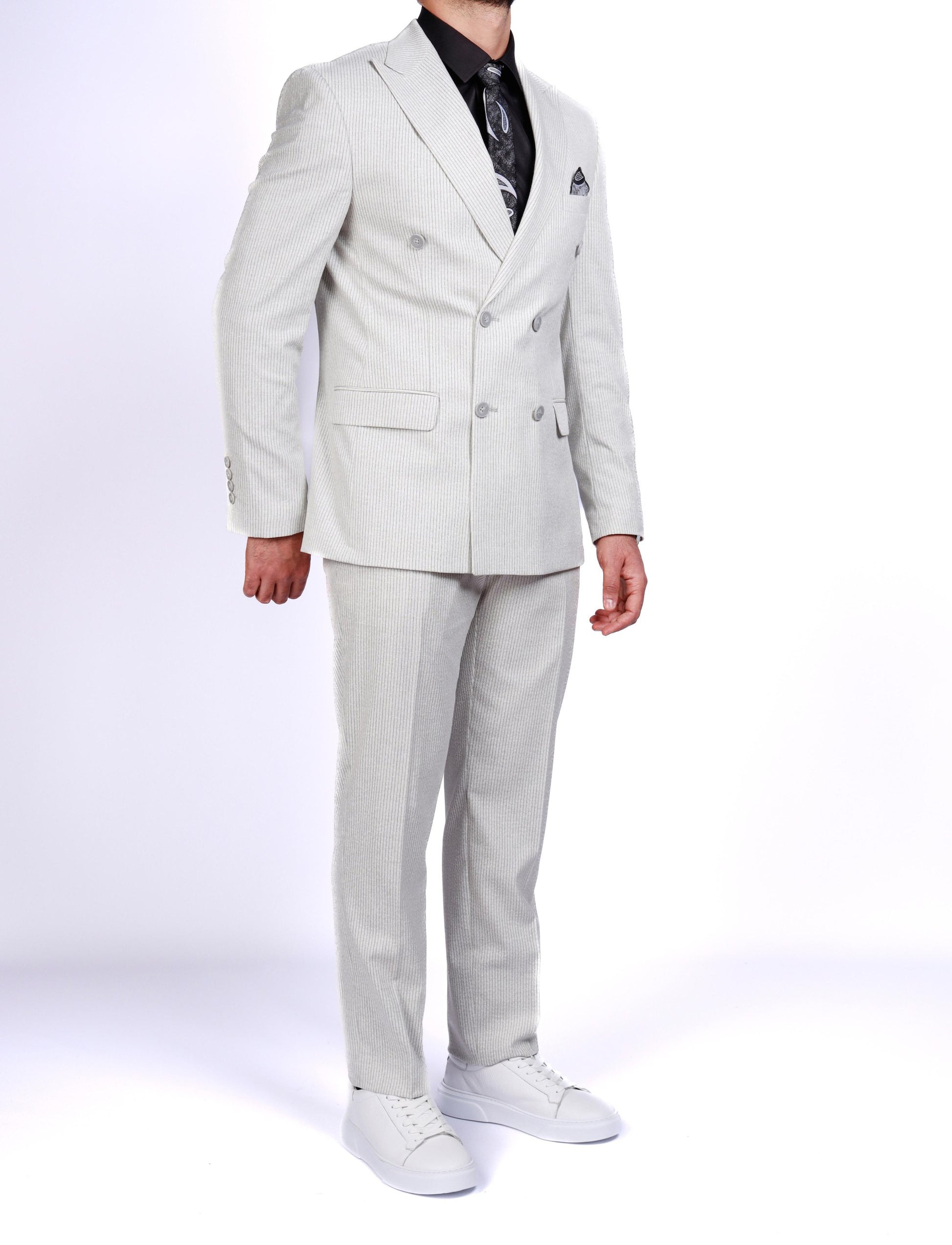 Light gray suit worn by a person on a white background