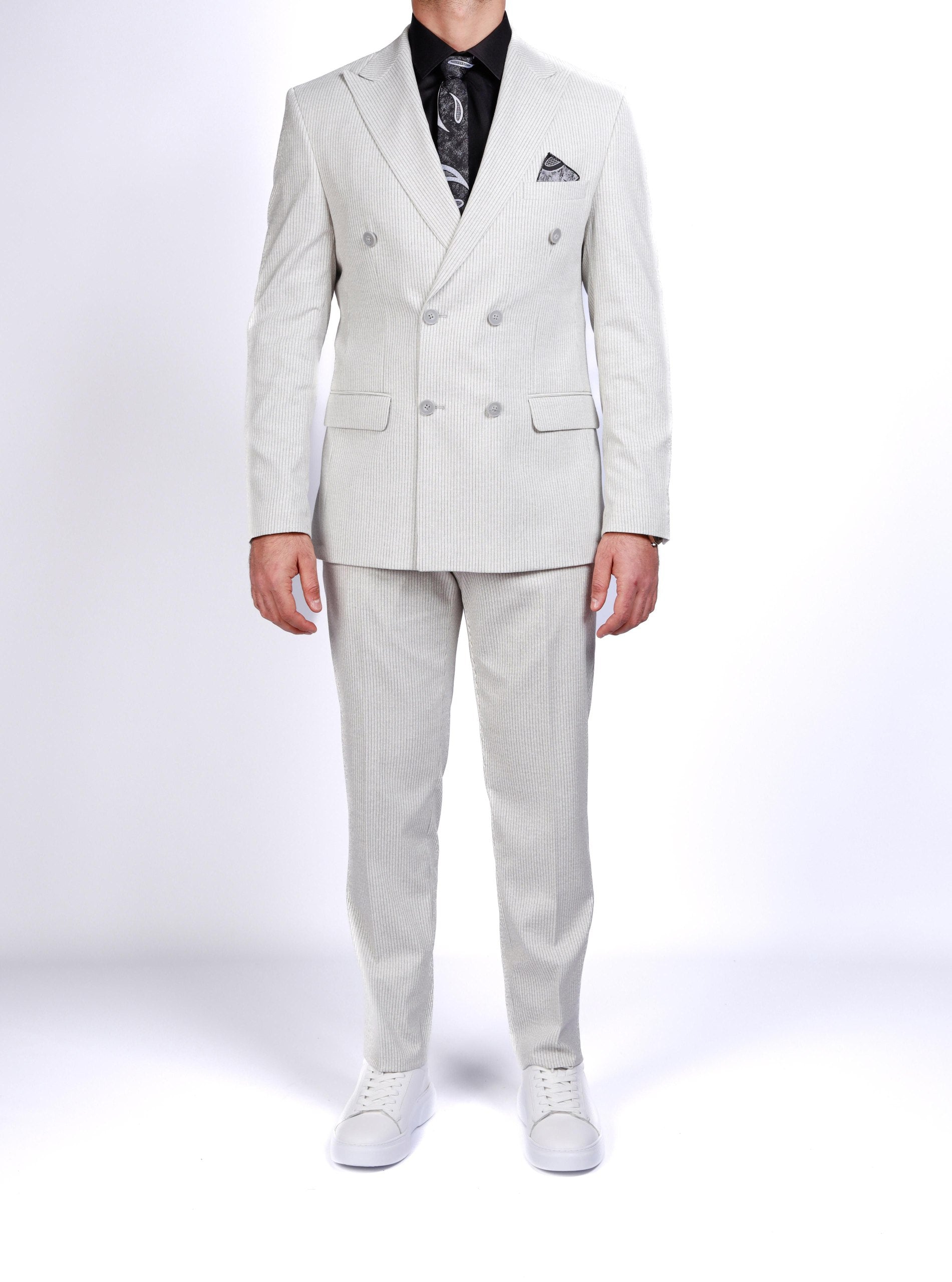 Light gray suit worn by a person on a white background