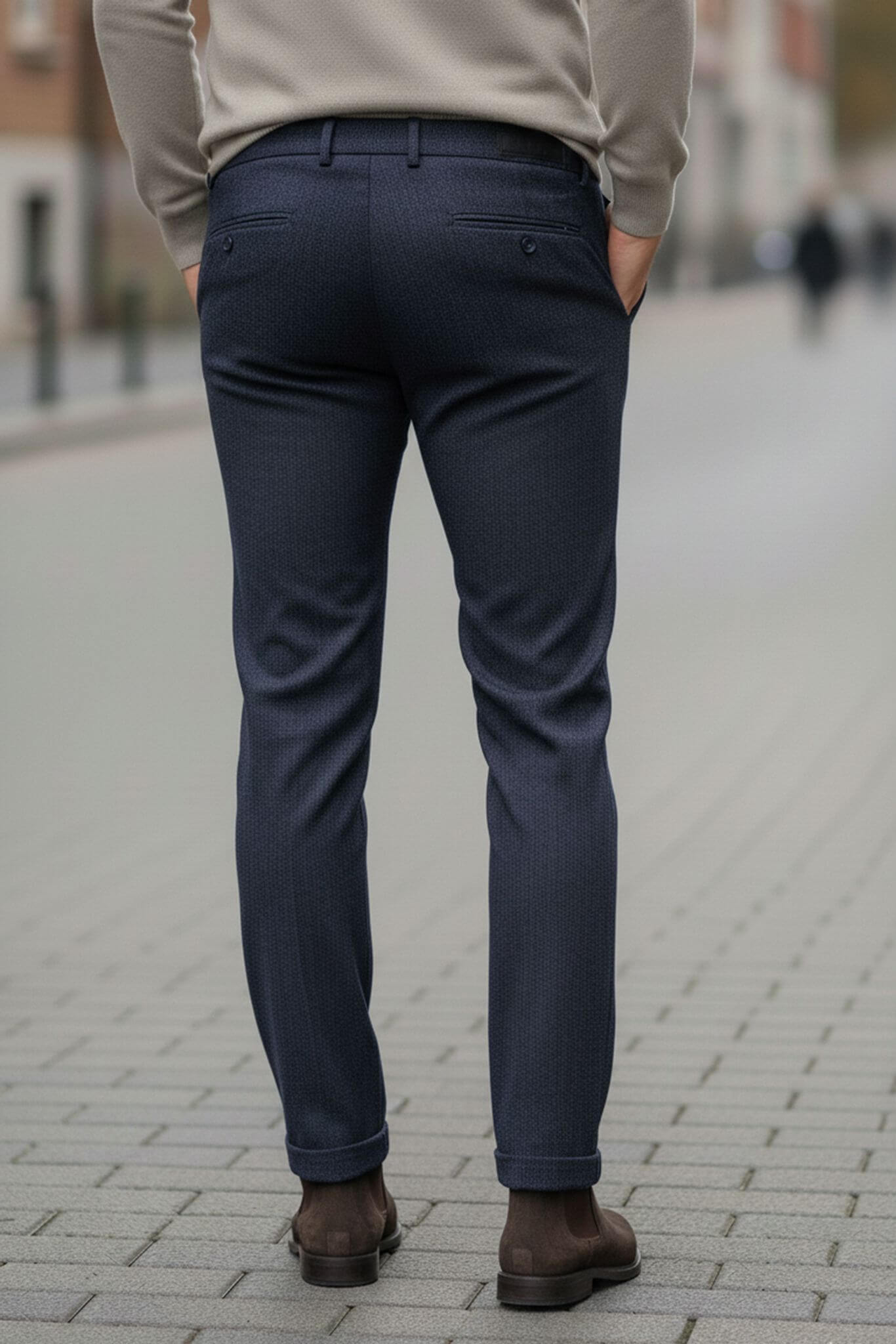 Person wearing navy pants on a street