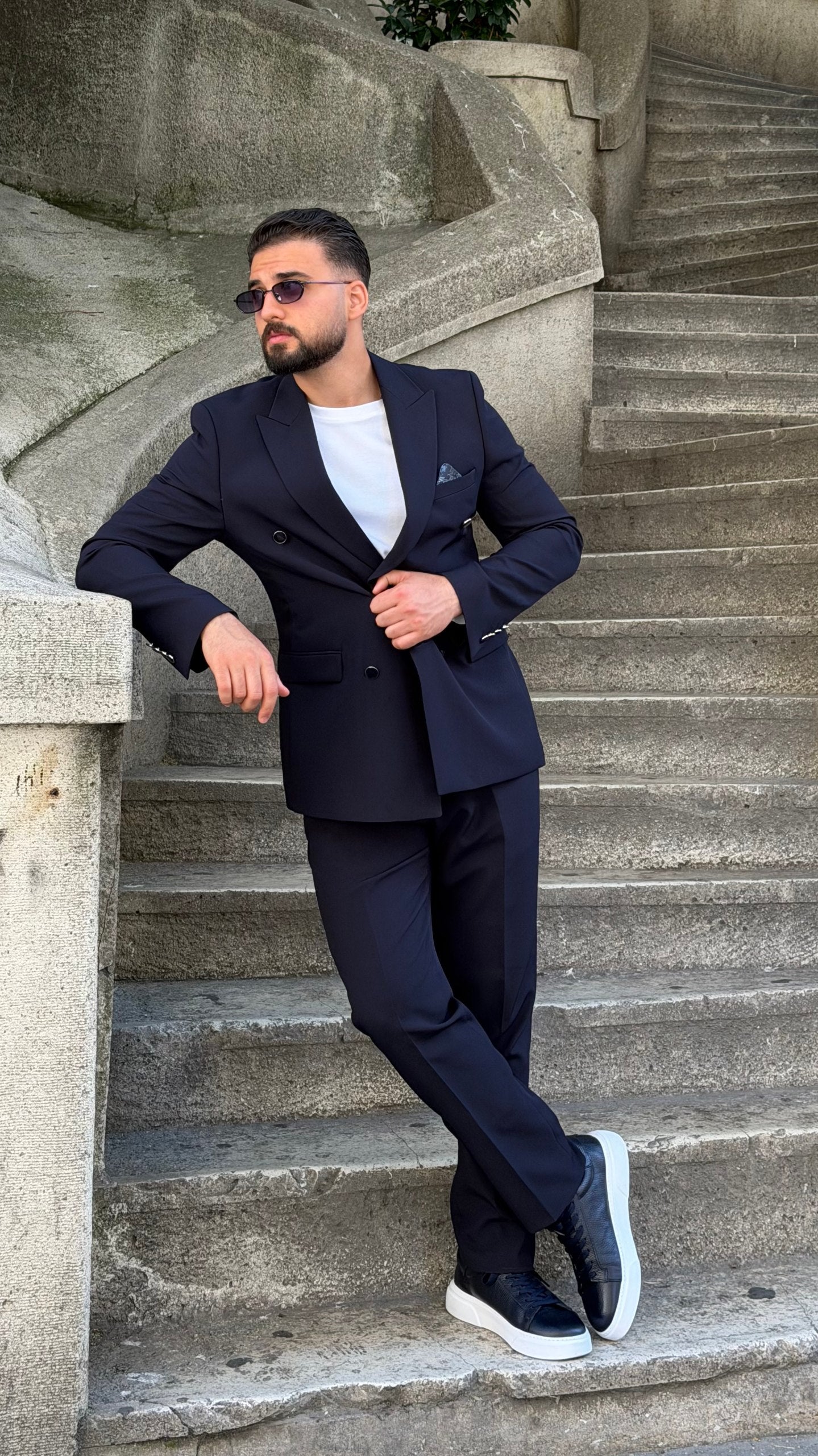 Navy two-piece formal suit with pocket-square styling