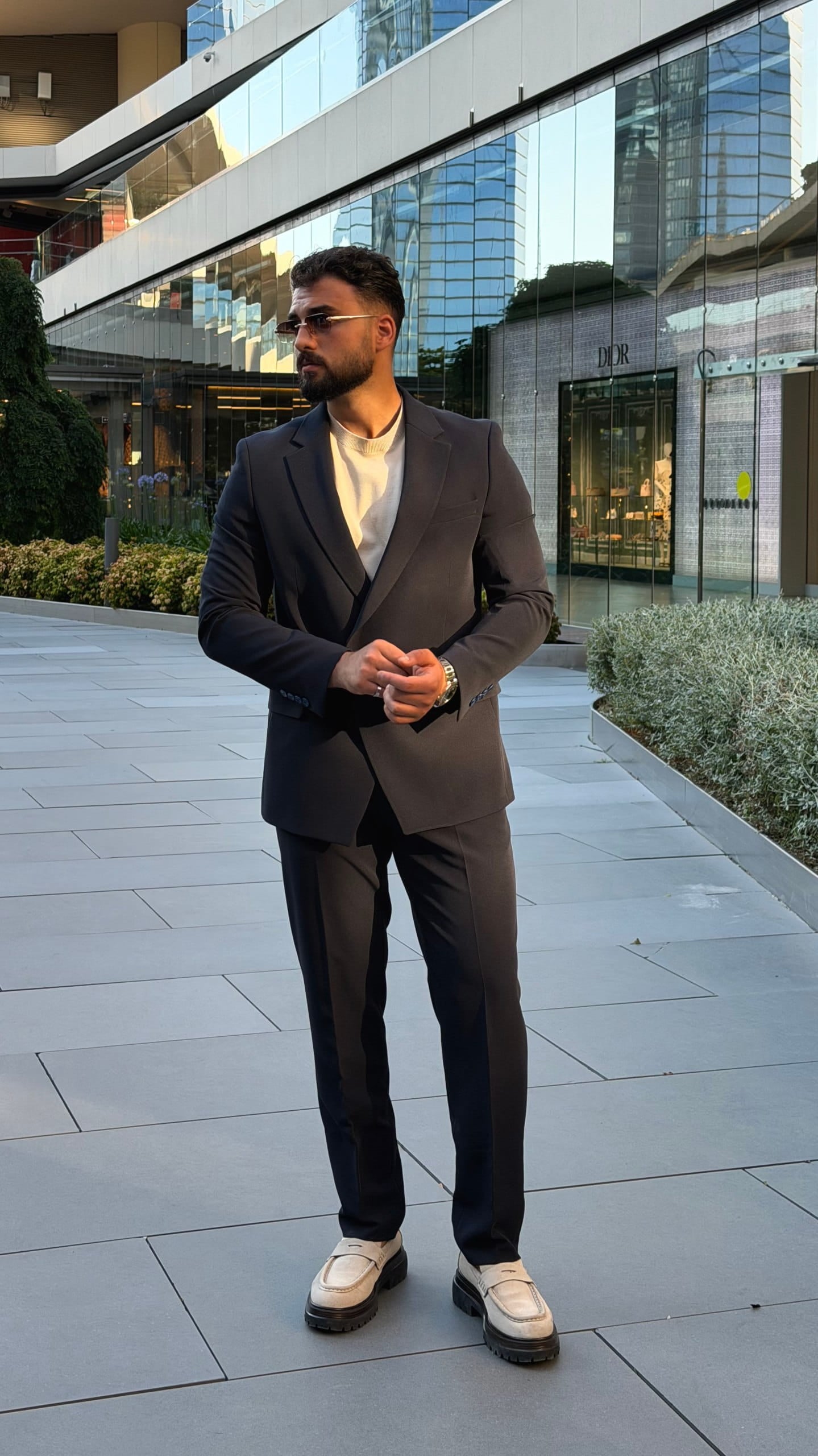 Navy formal suit showing structured lapel and chest pocket
