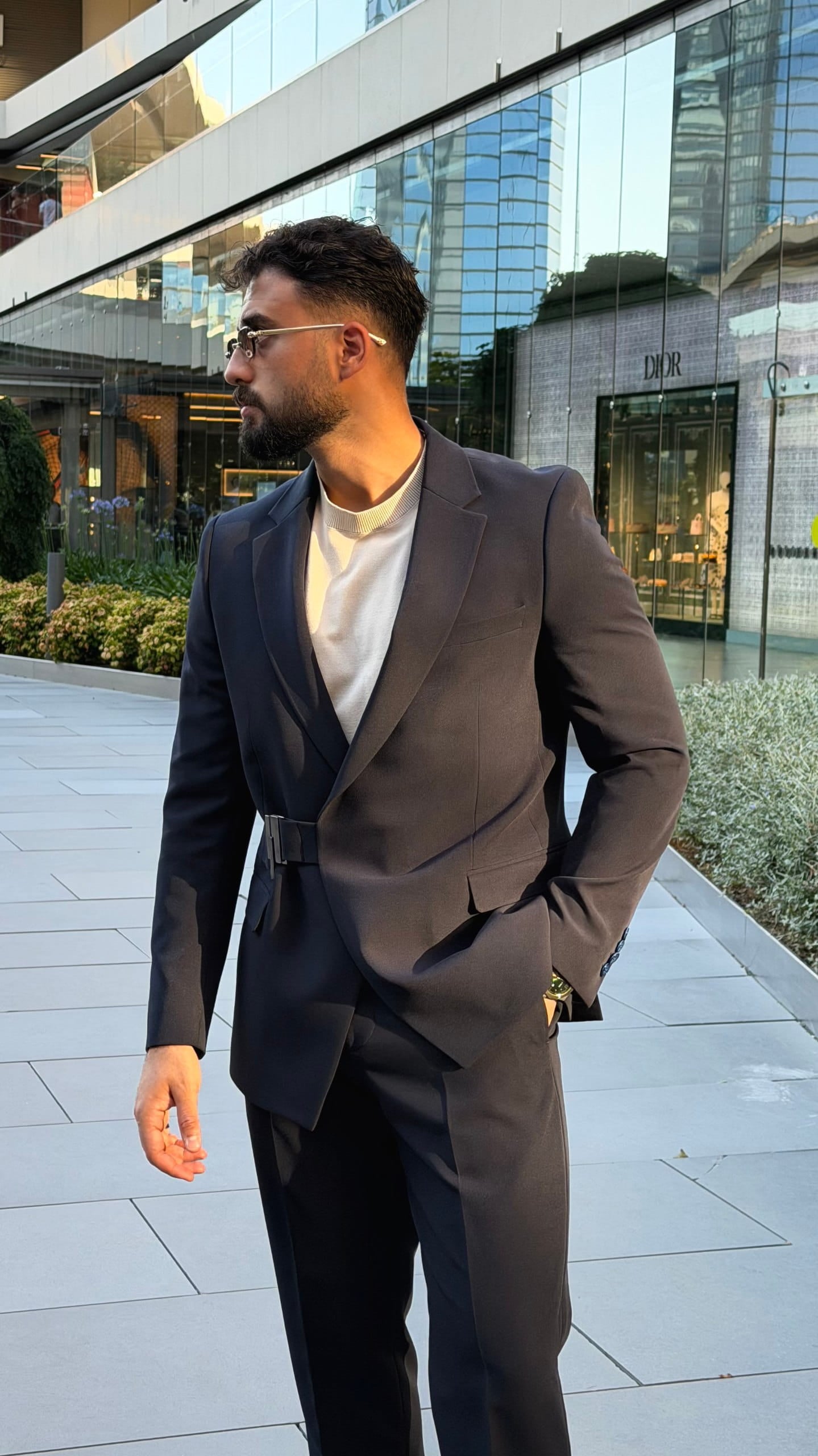 Full-length navy side-buckle suit with matching trousers