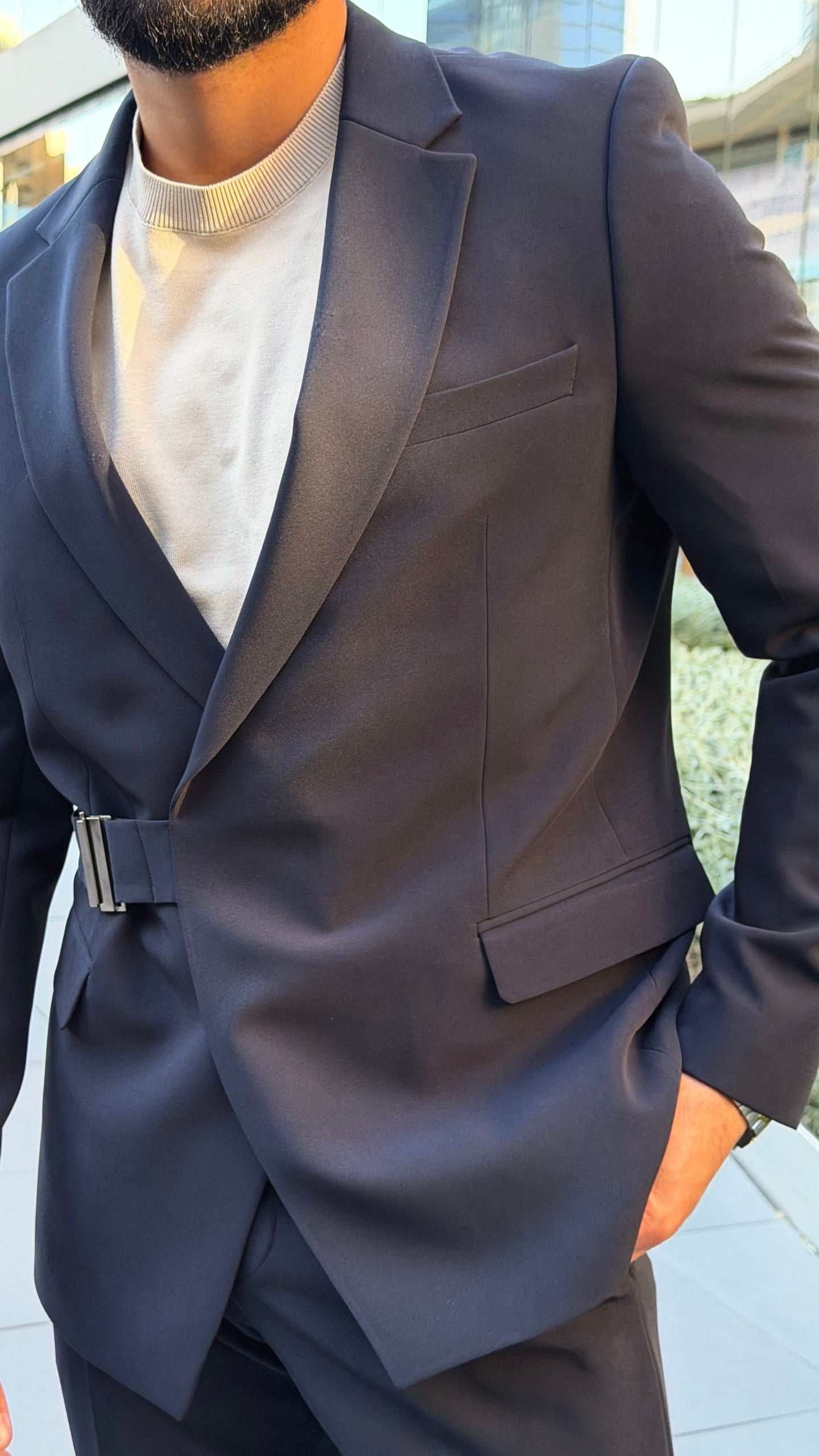 Men's navy wedding suit shown from an angled view