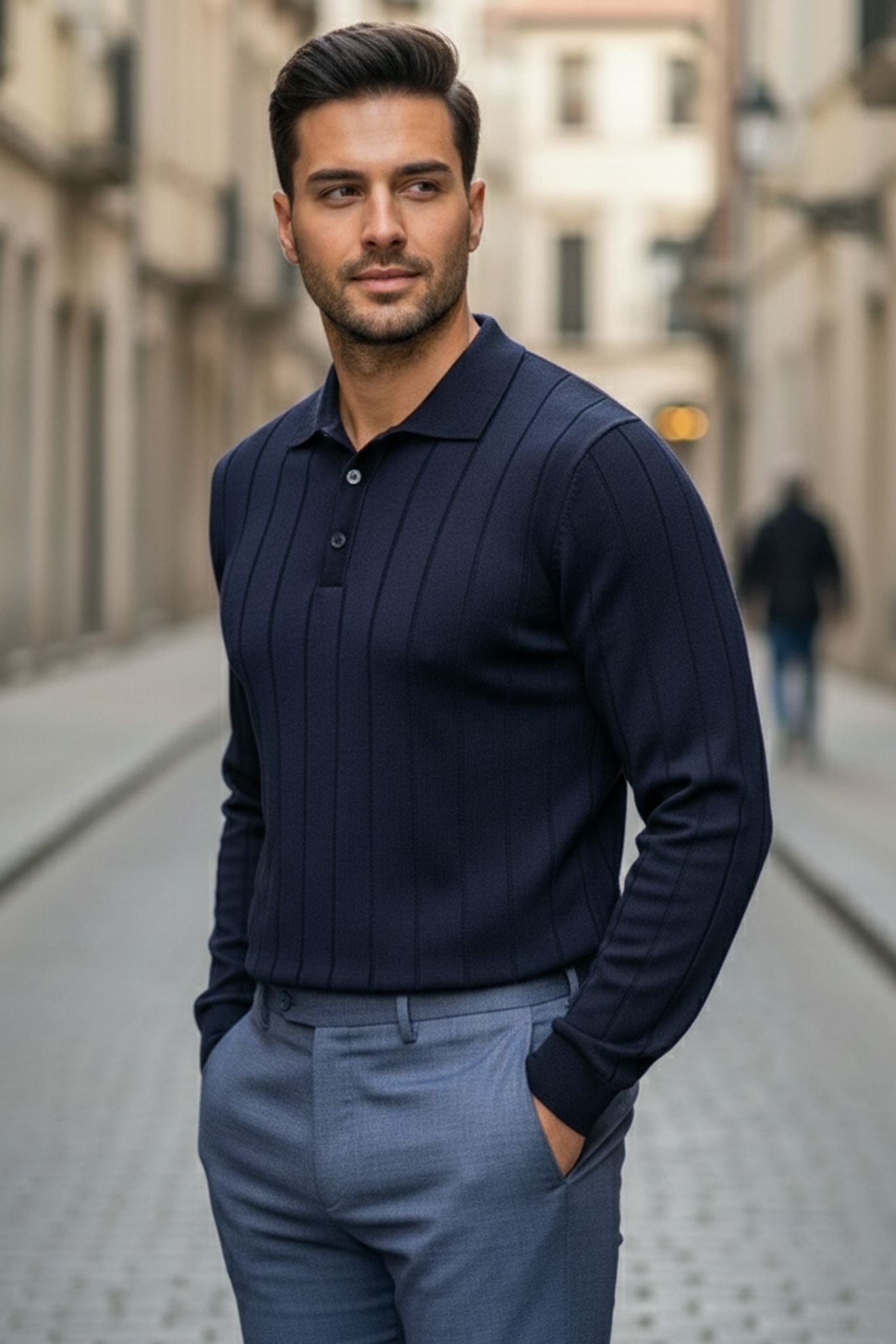 Man wearing a Slim-fit Ribbed Knitted Polo Sweater in Navy Blue and light gray pants on a city street